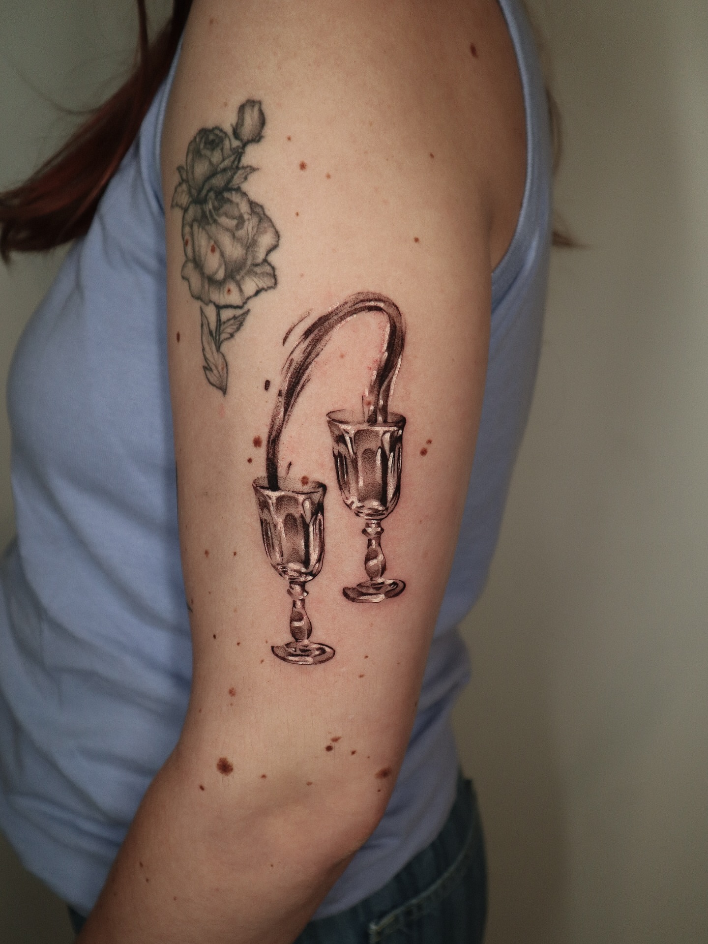 Wine glasses and rose black and grey tattoo on the forearm by 𝕮𝖔𝖓𝖓𝖔𝖗 ☾  ~ TATTOO ARTIST