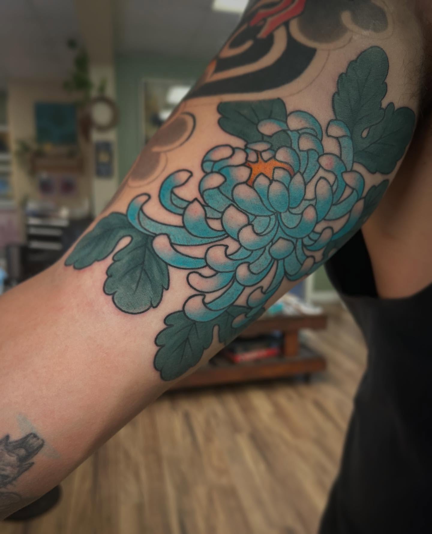 Chrysanthemum japanese irezumi tattoo on the forearm by Katie Dexter, Des Moines, Iowa