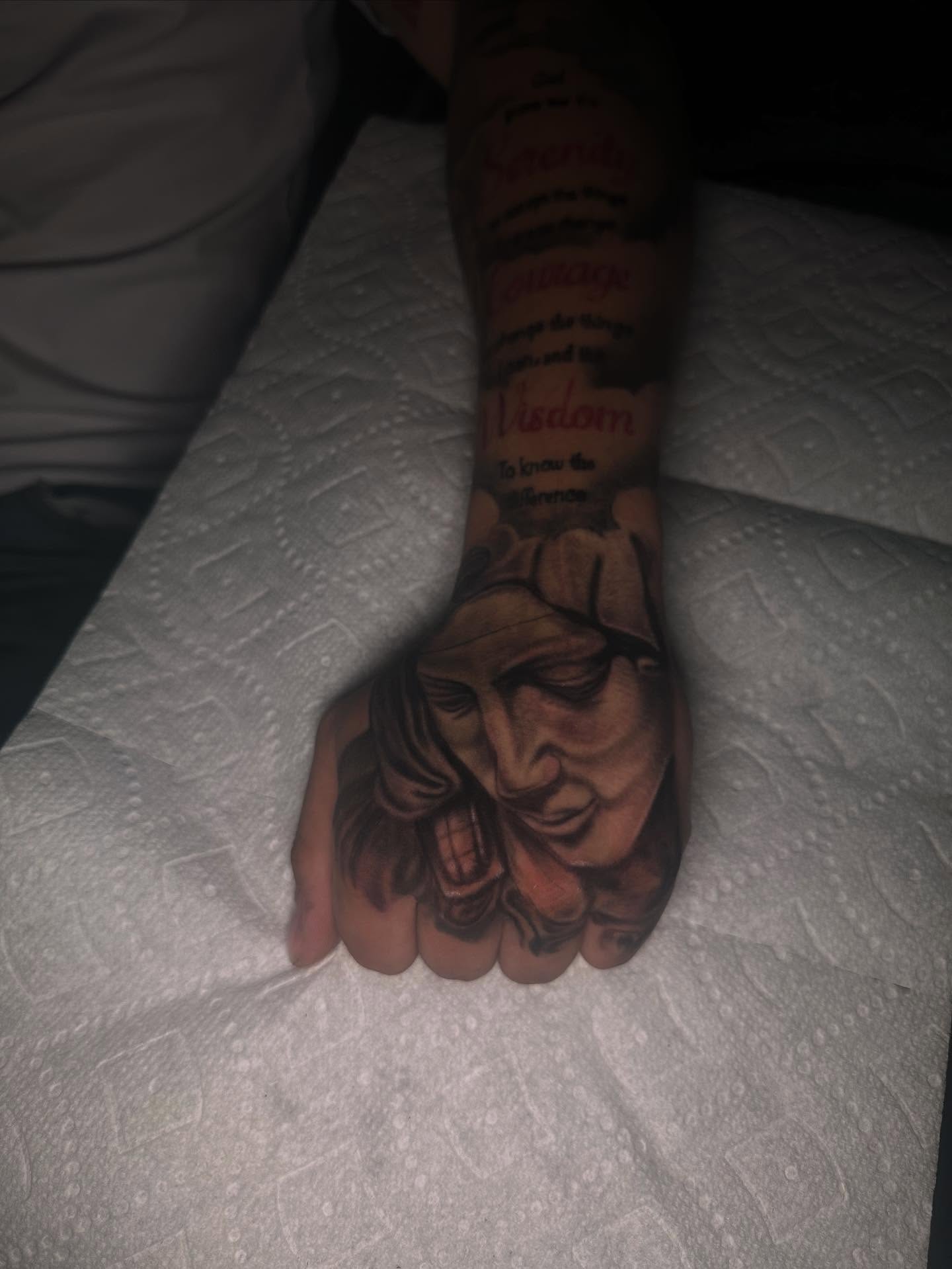Portrait realism tattoo on the hand by Aj Negrete Jr.