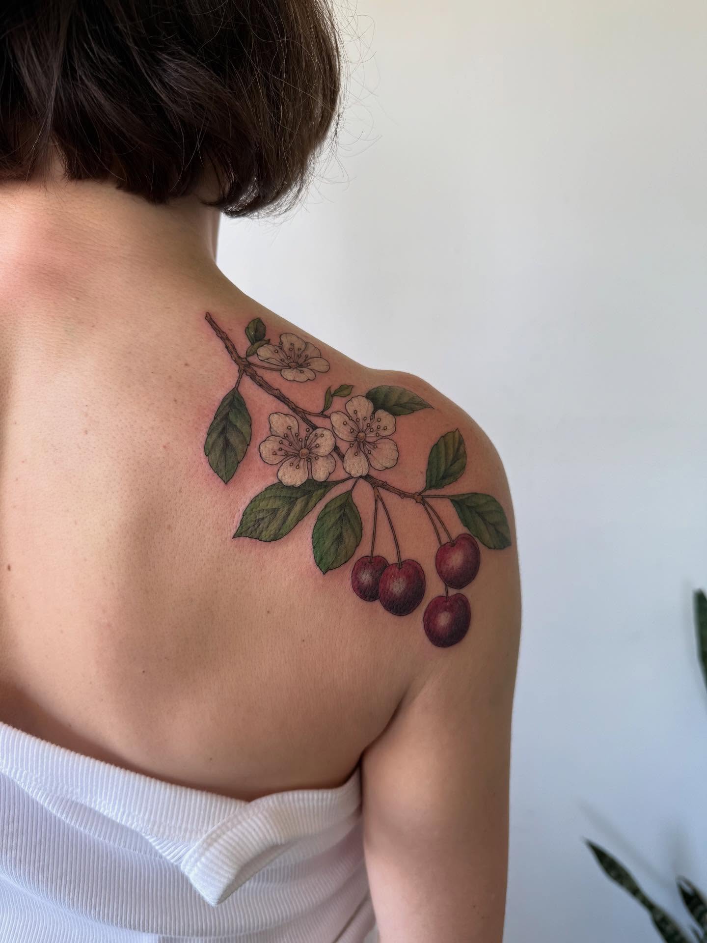 Cherry blossom branch realism tattoo on the shoulder by See See : botanical tattoo artist :