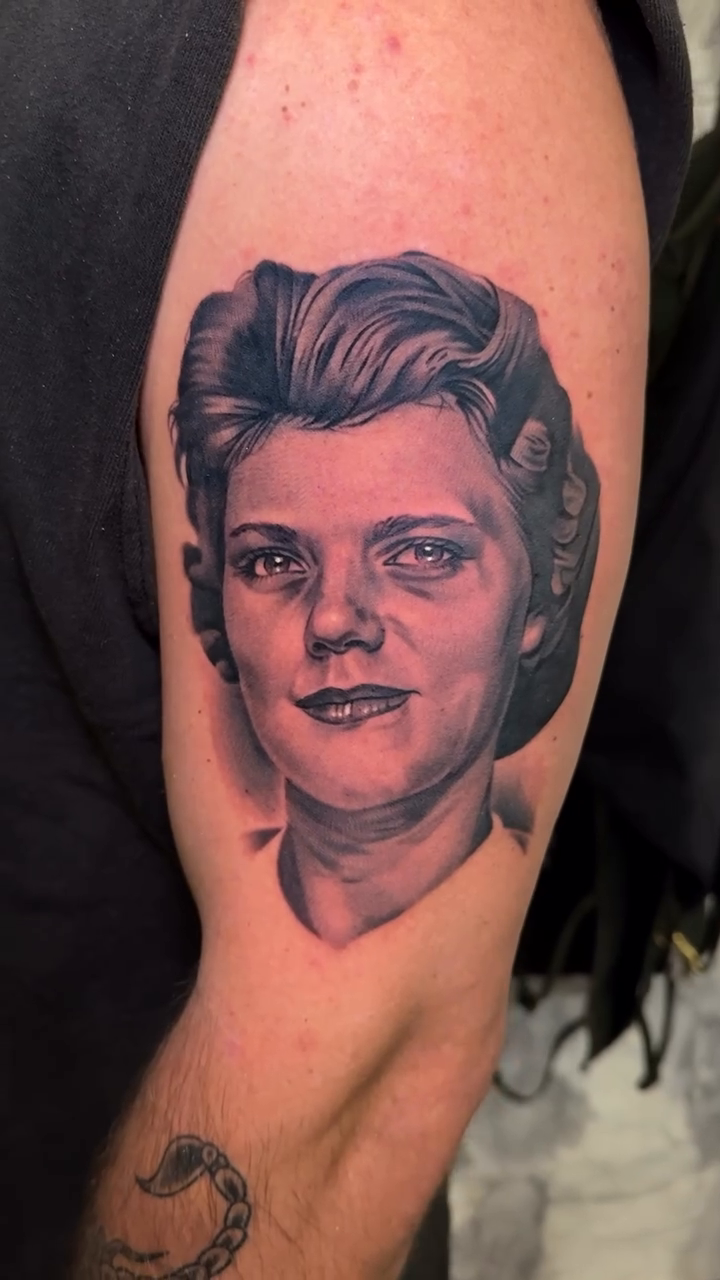 Portrait of a woman realism tattoo by Bradley Dozier