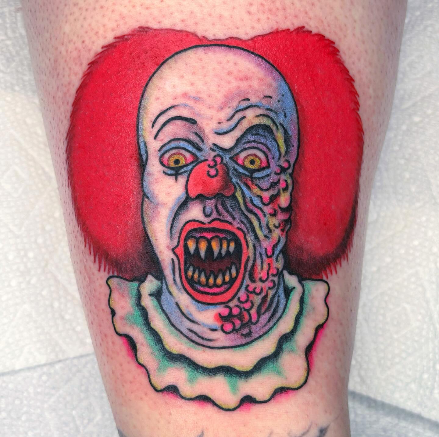 Clown American traditional tattoo on the leg by Randy Conner, Portland, Oregon