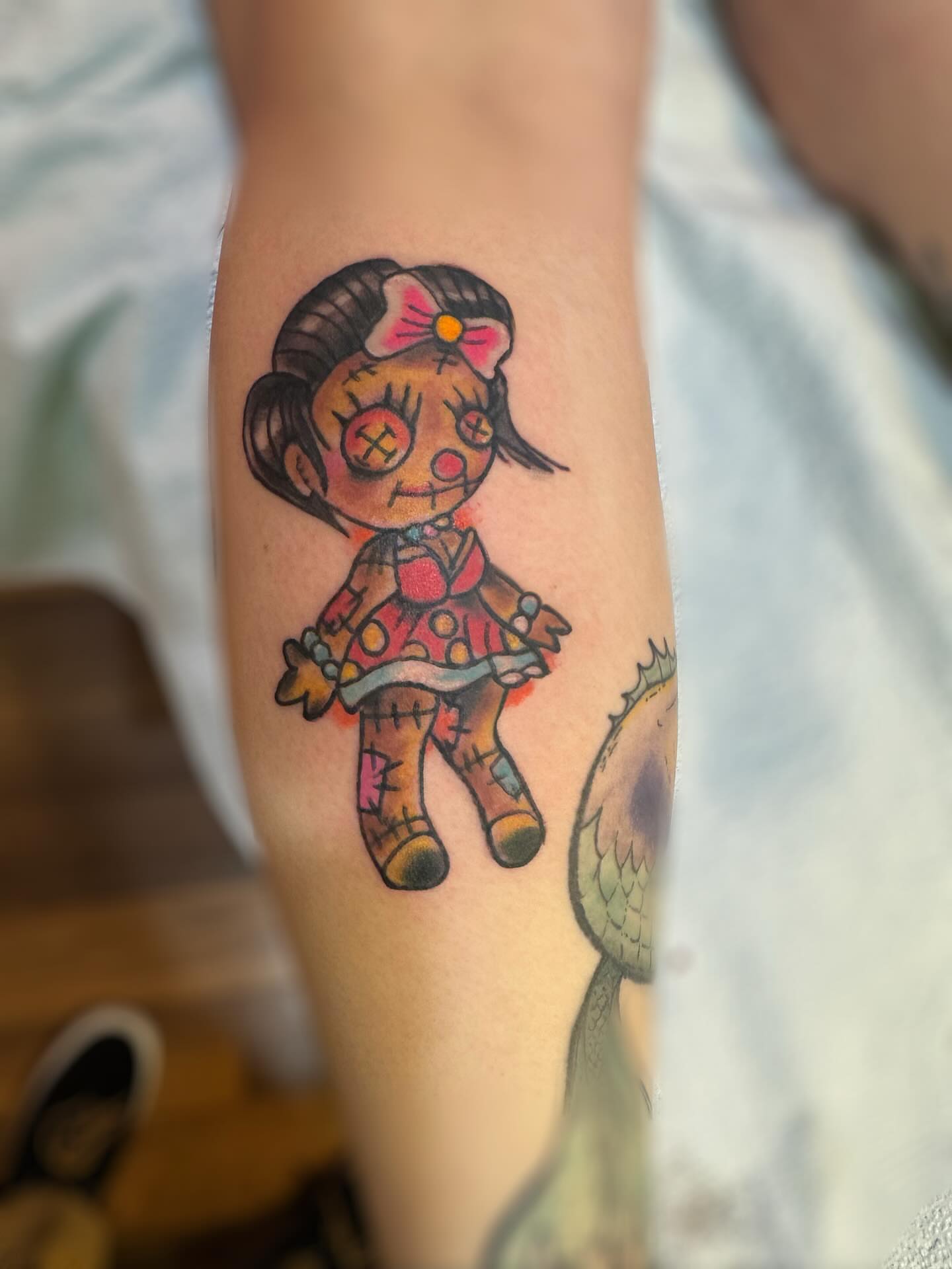 Rag doll trash polka tattoo on the forearm by @brocks_tatt_attic_, New Orleans, Louisiana