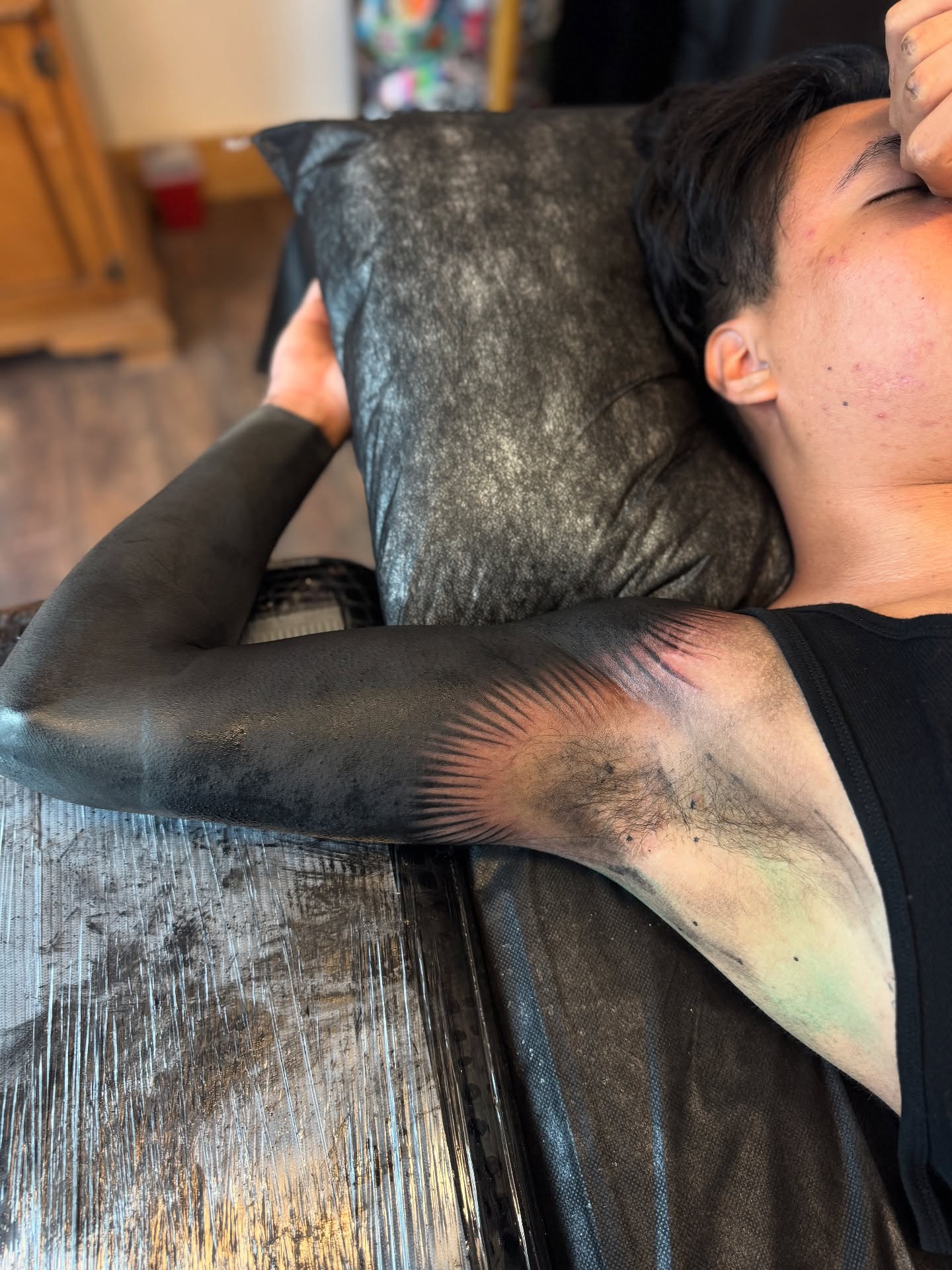 Abstract design black and grey tattoo on the upper arm by Denver Blackout Tattoo Specialist - Anthony