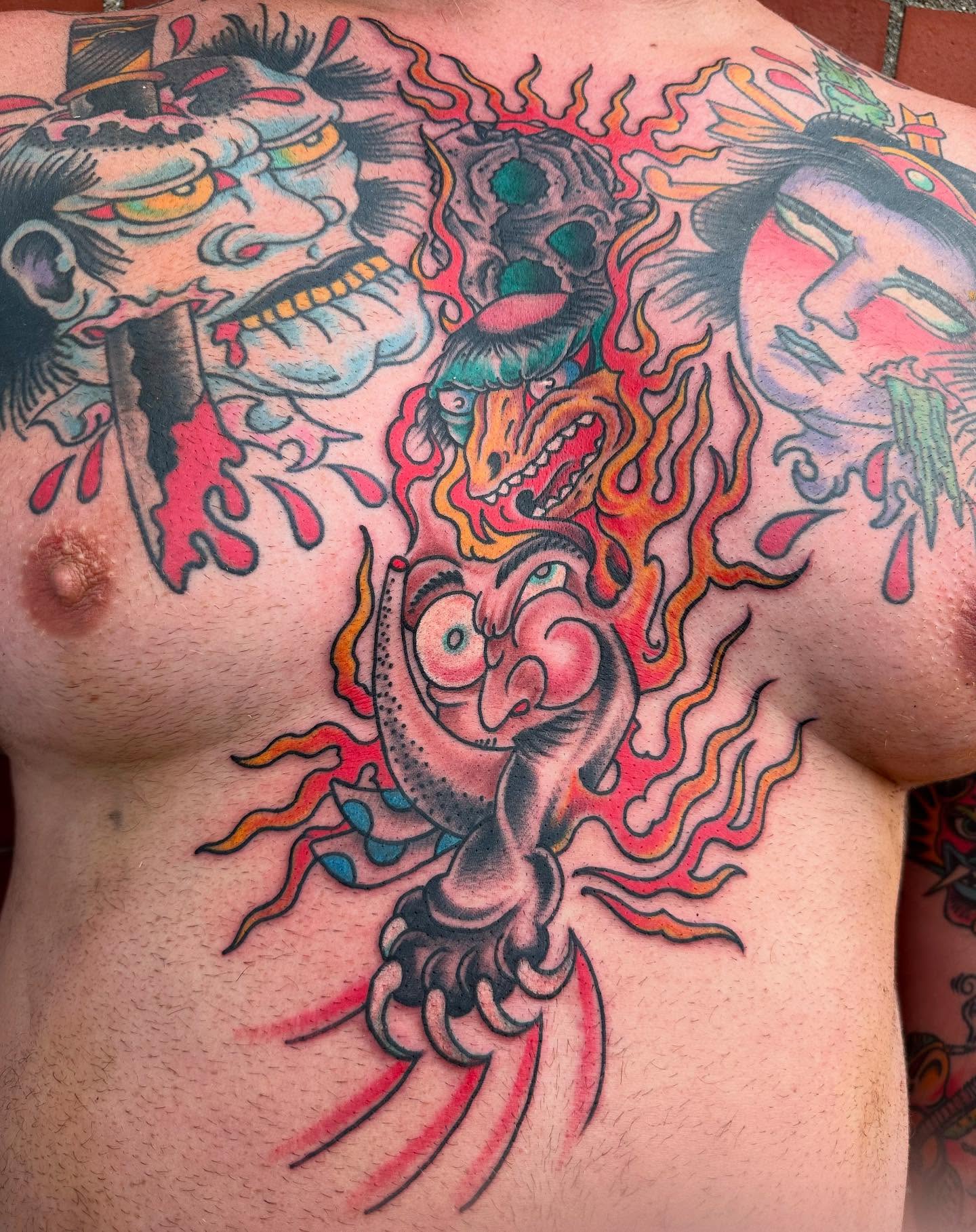 Demon heads japanese irezumi tattoo on the chest by Devin Spenny
