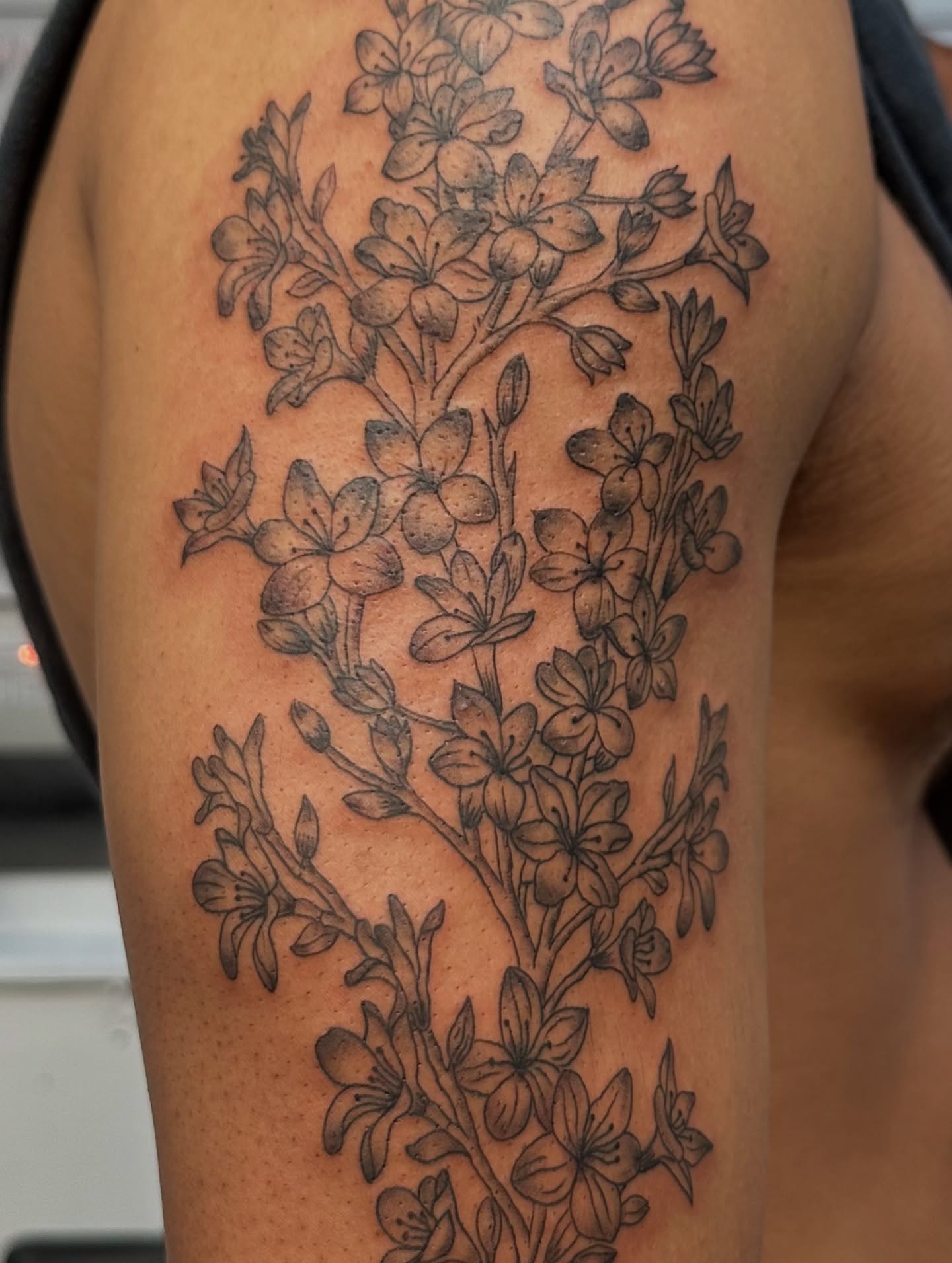 Flower bouquet black and grey tattoo on the thigh by Piccolino, Cambridge, Massachusetts