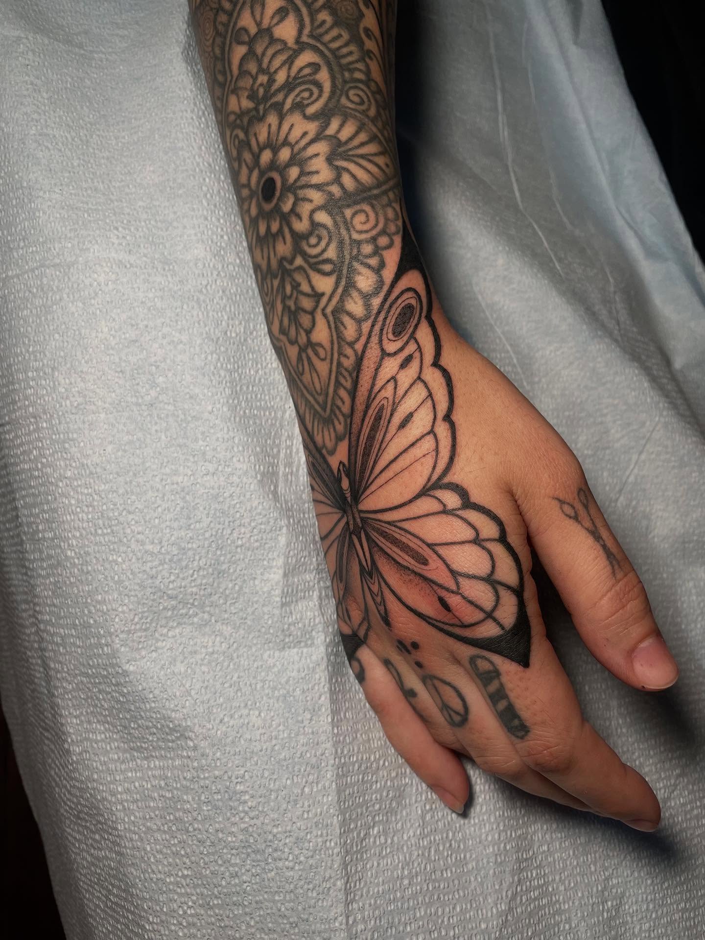 Butterfly black and grey tattoo on the hand by Danika Brooke 🧿