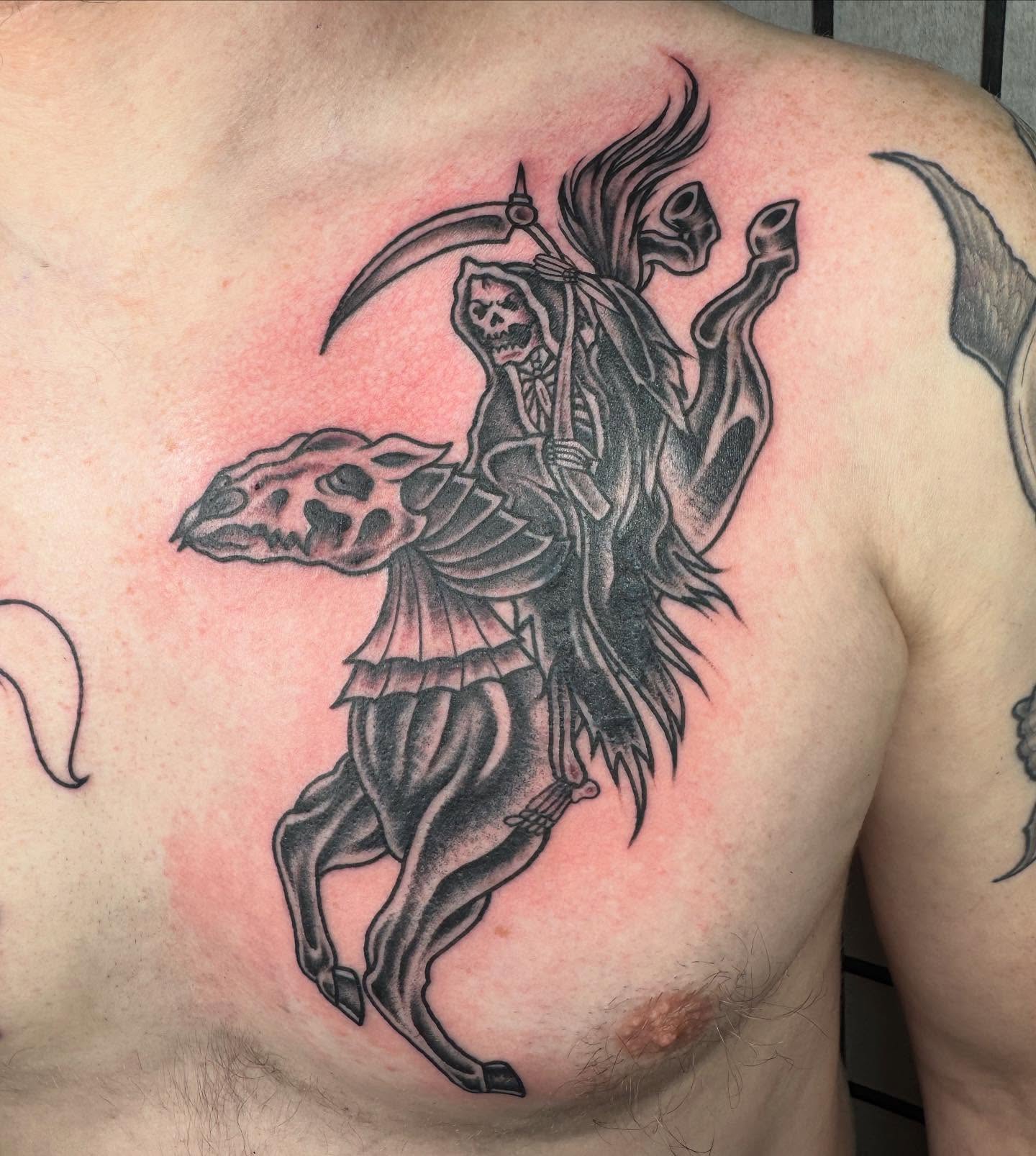 Grim reaper black and grey tattoo on the chest by Justina🪐