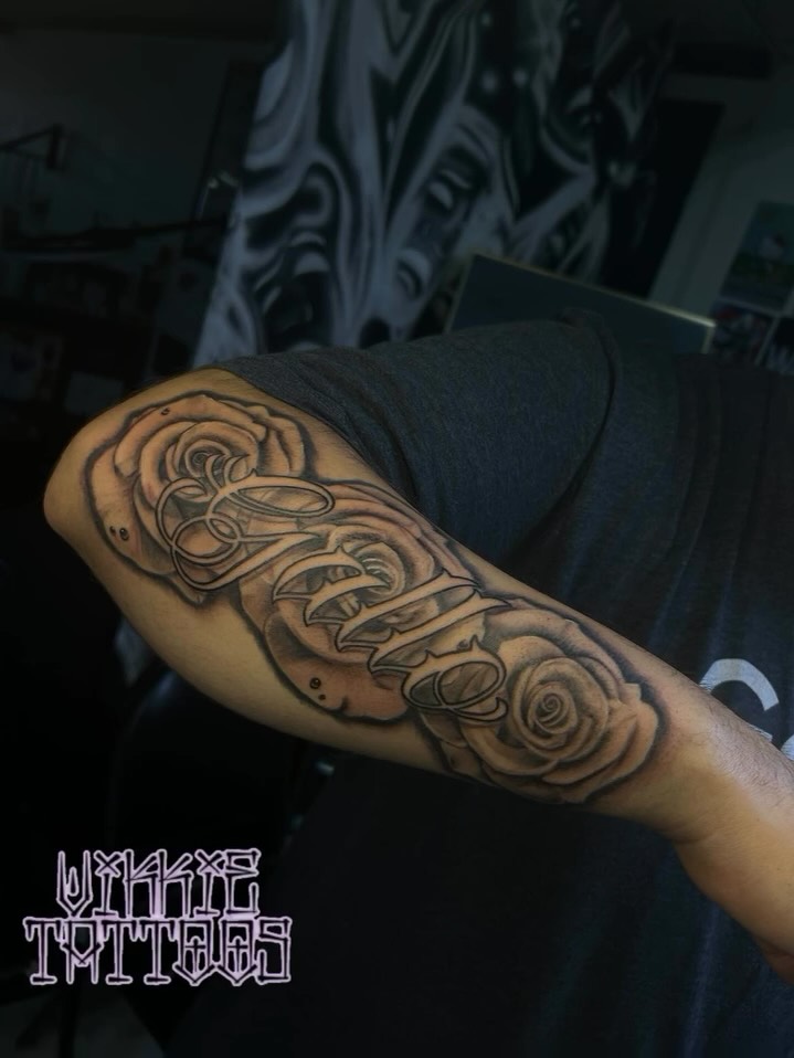 Roses and thorns realism tattoo on the forearm by Victoria Mendez