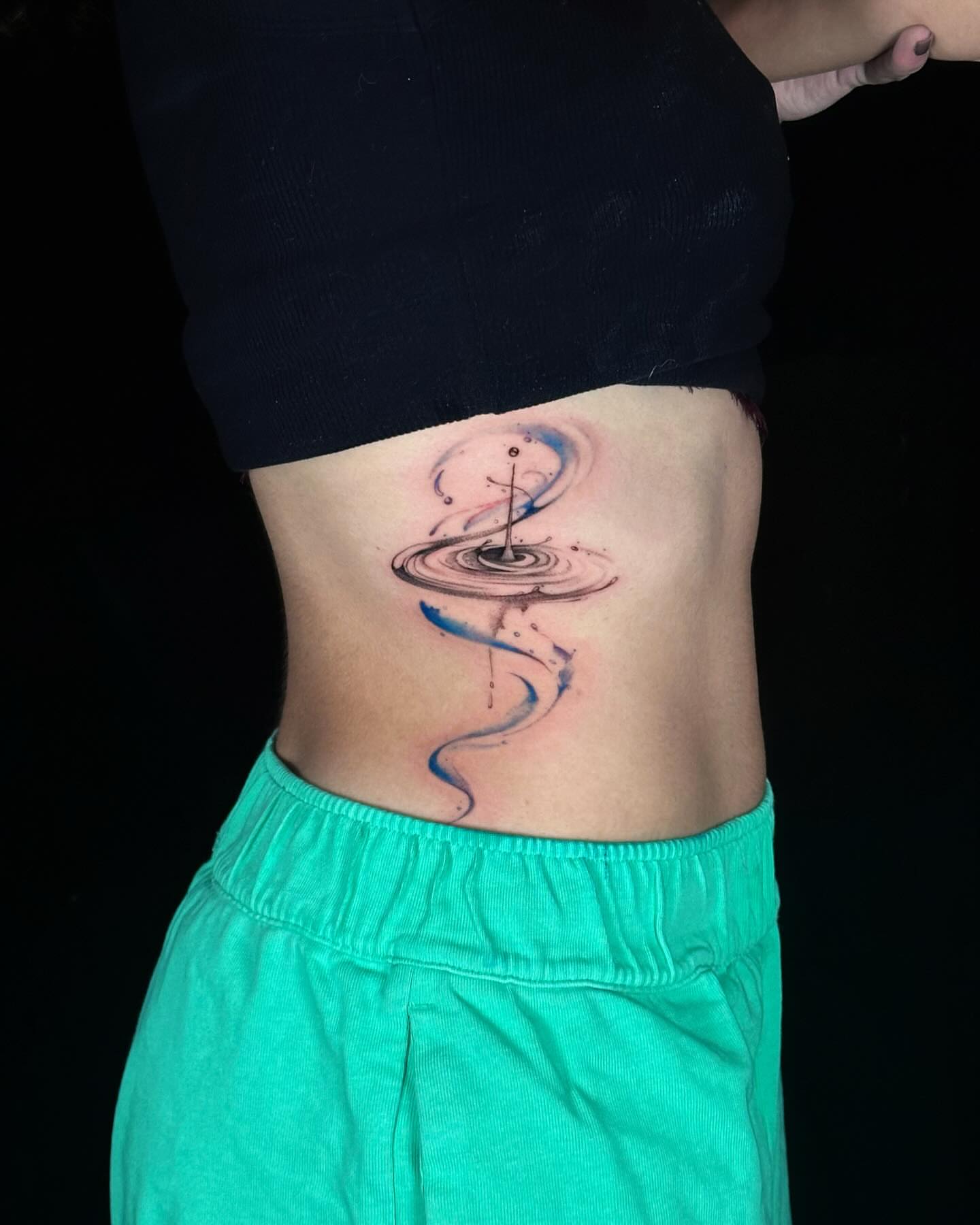 Water droplet dotwork tattoo on the torso by Alice Li, Houston, Texas