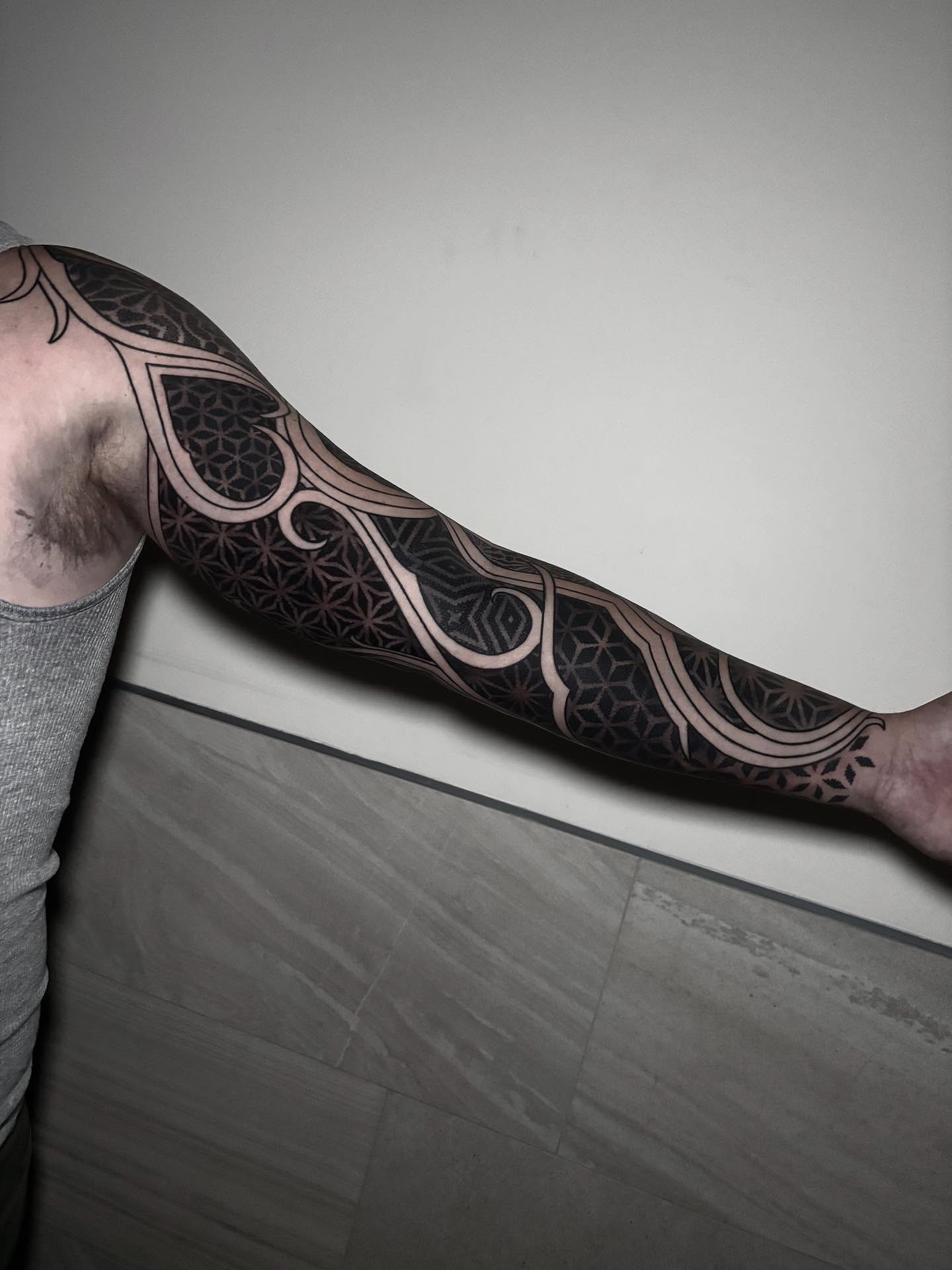 Geometric pattern geometric tattoo on the forearm by Eric Hare