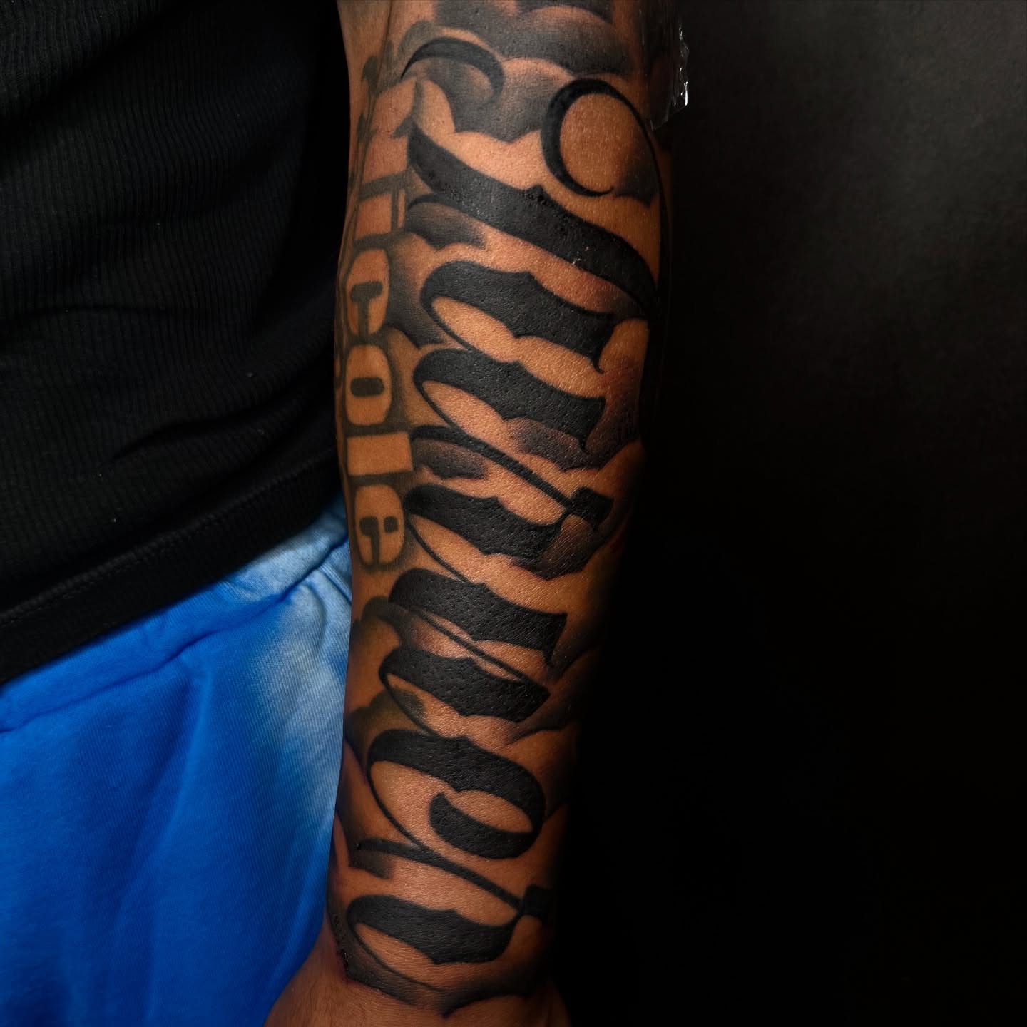 Tiger stripe black and grey tattoo on the forearm by Elijah East
