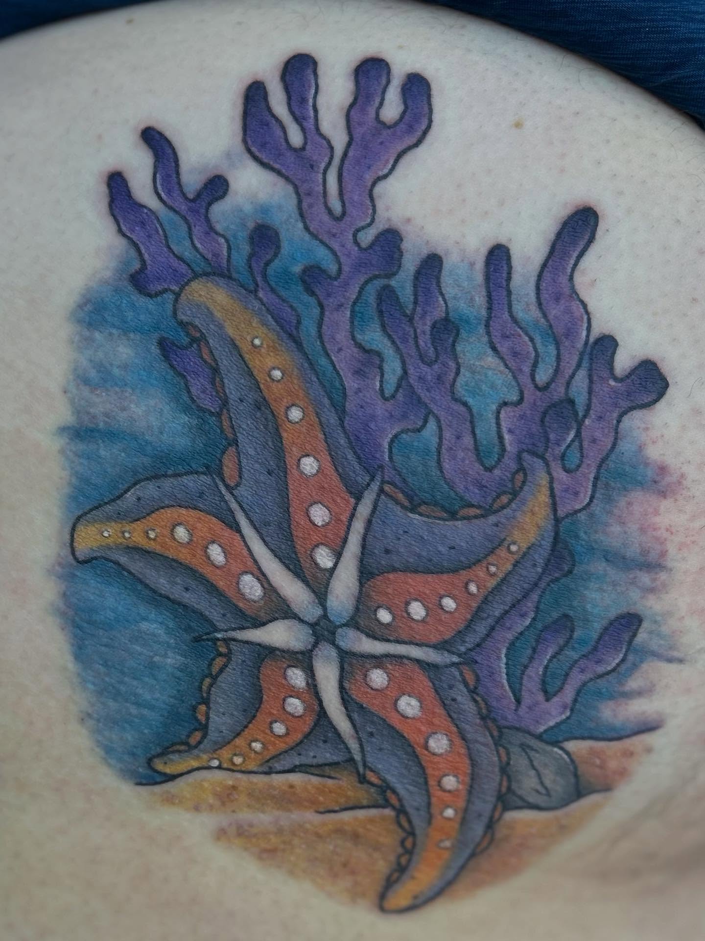 Coral and starfish watercolor tattoo on the torso by Abby Watts, Columbus, Ohio