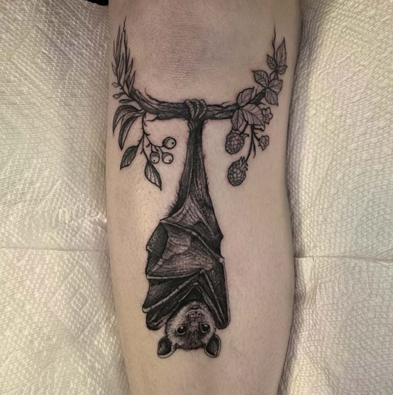 Bat hanging from branch realism tattoo on the forearm by amanda malia wega