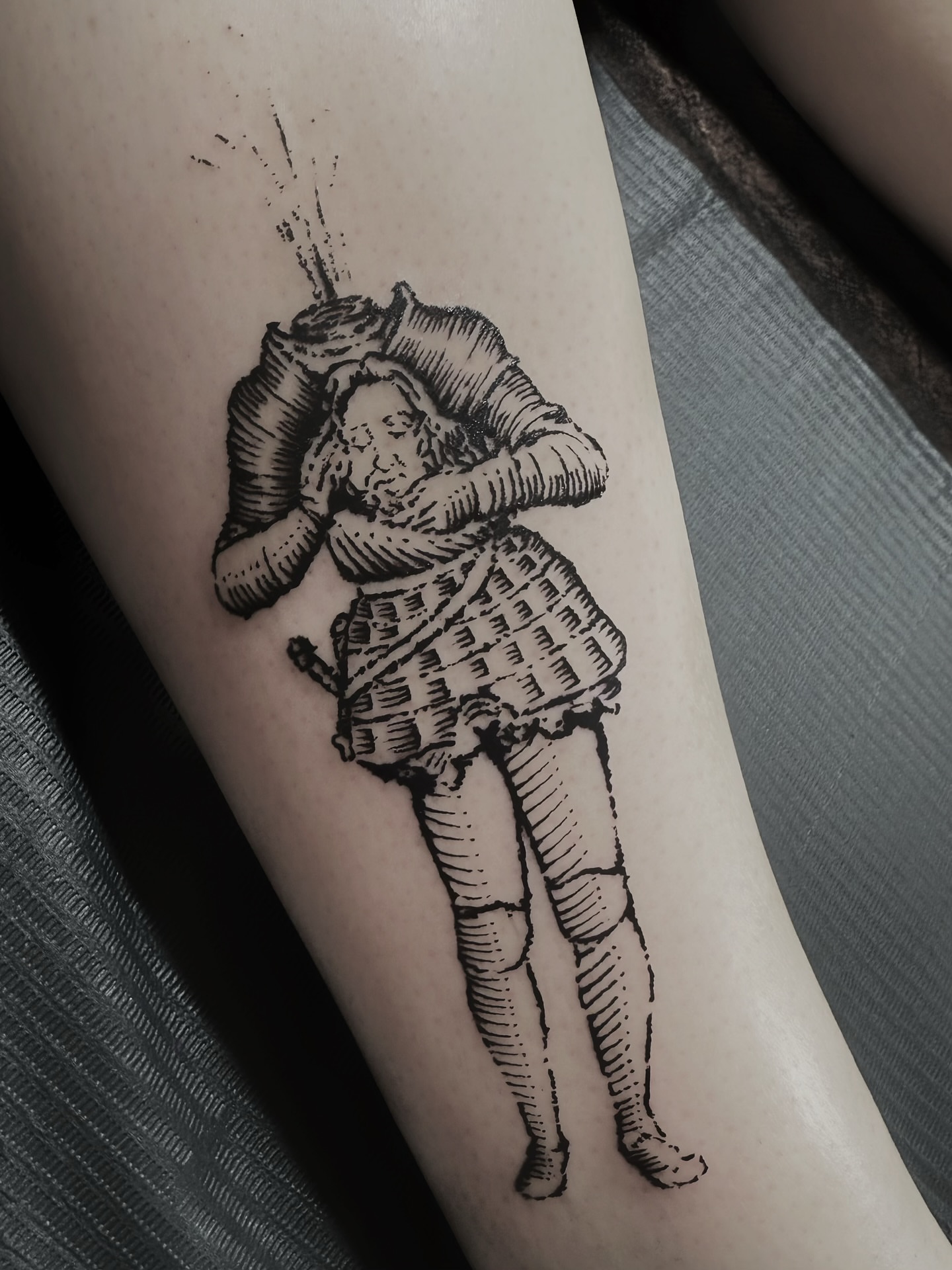 Man in armor black and grey tattoo on the forearm by ꜰʟᴏʀᴀ ᴡᴏᴏᴅᴄᴜᴛ ᴛᴀᴛᴛᴏᴏ