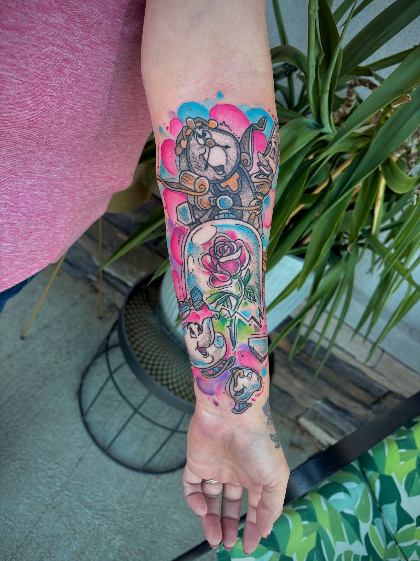 Cartoon characters and floral elements new school tattoo on the forearm by Bunny Noel