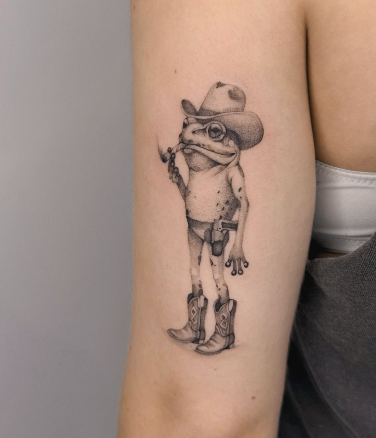 Cowboy frog realism tattoo on the forearm by Blackwork & microrealism tattoos