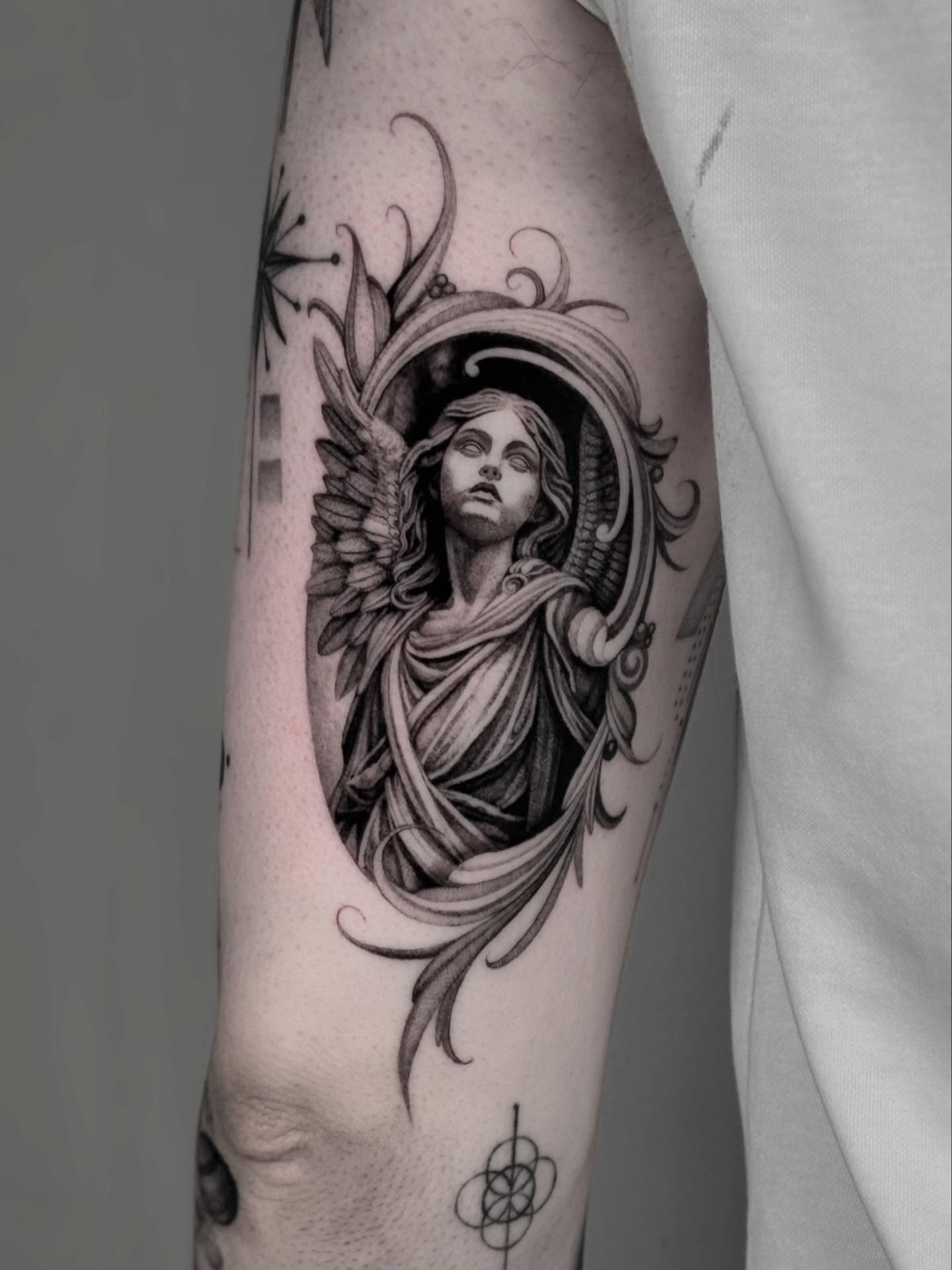 Angel realism tattoo on the forearm by Brittney Naami, San Francisco, California