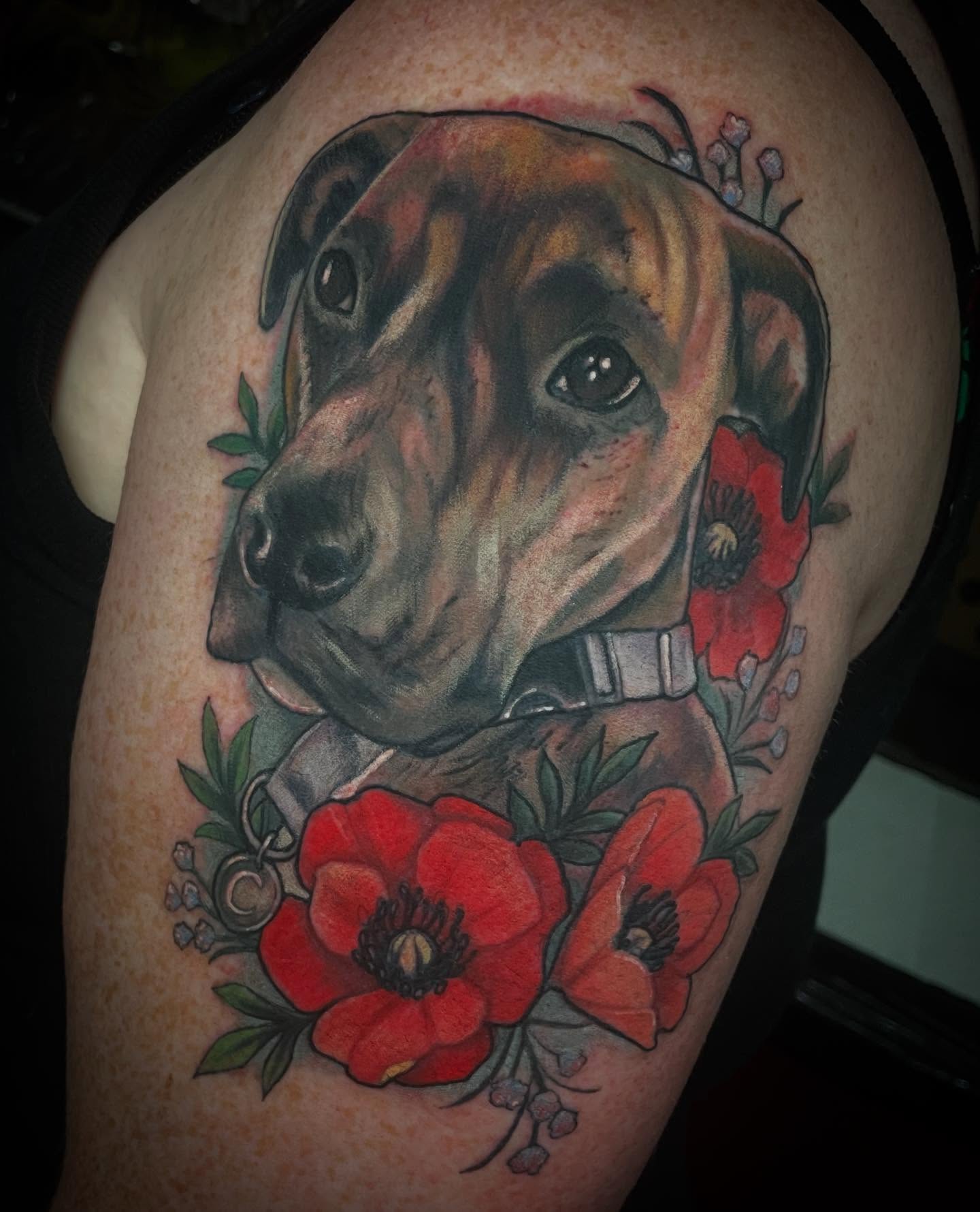 Dog with poppies realism tattoo on the shoulder by Leah Marie, Cincinnati