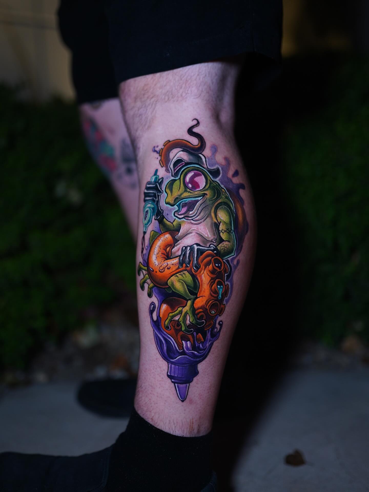 Frog new school tattoo on the calf by Zoe "Z" Fisk