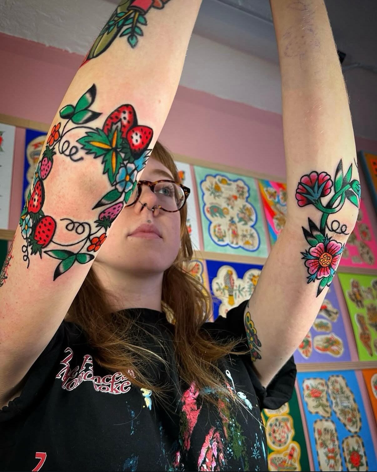 Strawberries and flowers American traditional tattoo on the forearm by Britt Kuechenmeister, Culver City, California