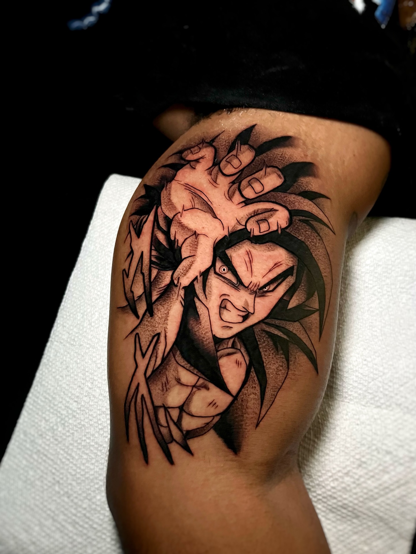 Anime character anime tattoo on the upper arm by Matthew Diaz
