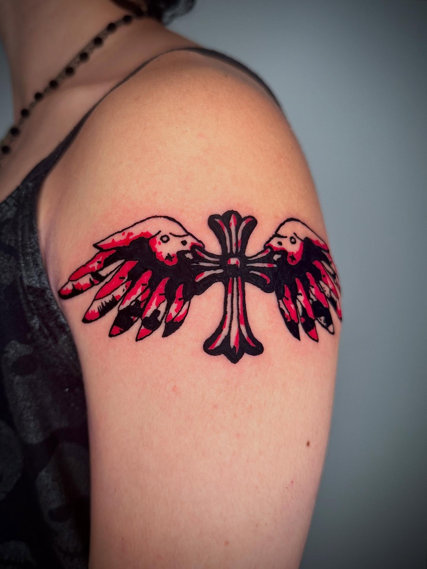 Cross with wings American traditional tattoo on the shoulder by 𝔠𝔲𝔯𝔱𝔦𝔰 ~ tattoo artist