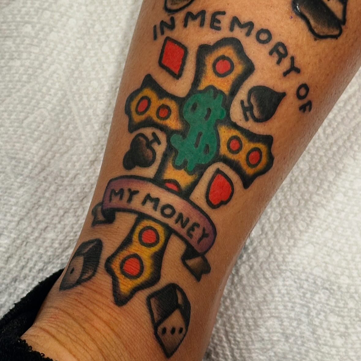 Cross with playing cards American traditional tattoo on the forearm by Rob, Nashville, Tennessee