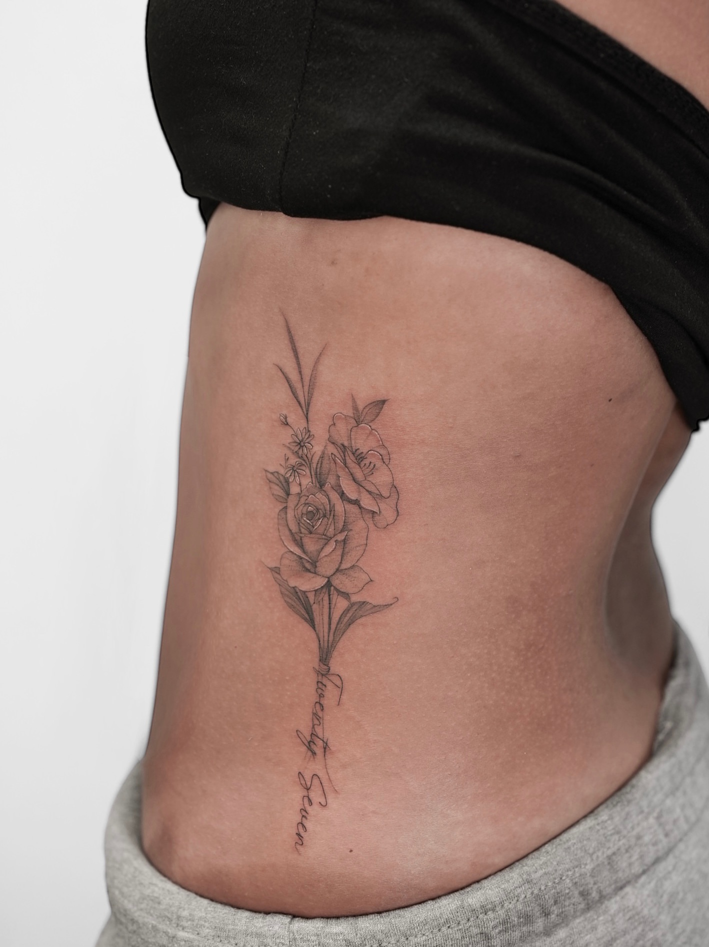 Flower bouquet realism tattoo on the ribs by X