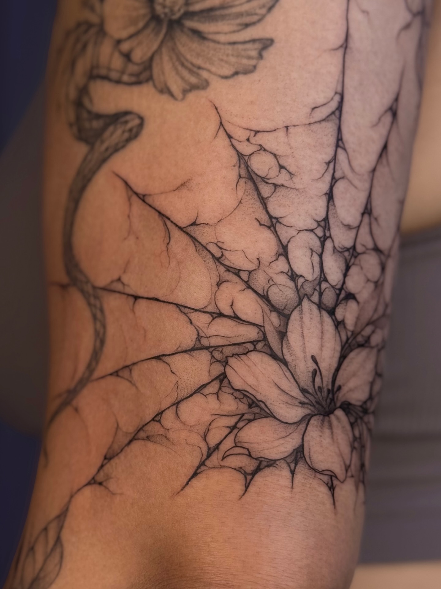 Floral design realism tattoo on the forearm by Daria