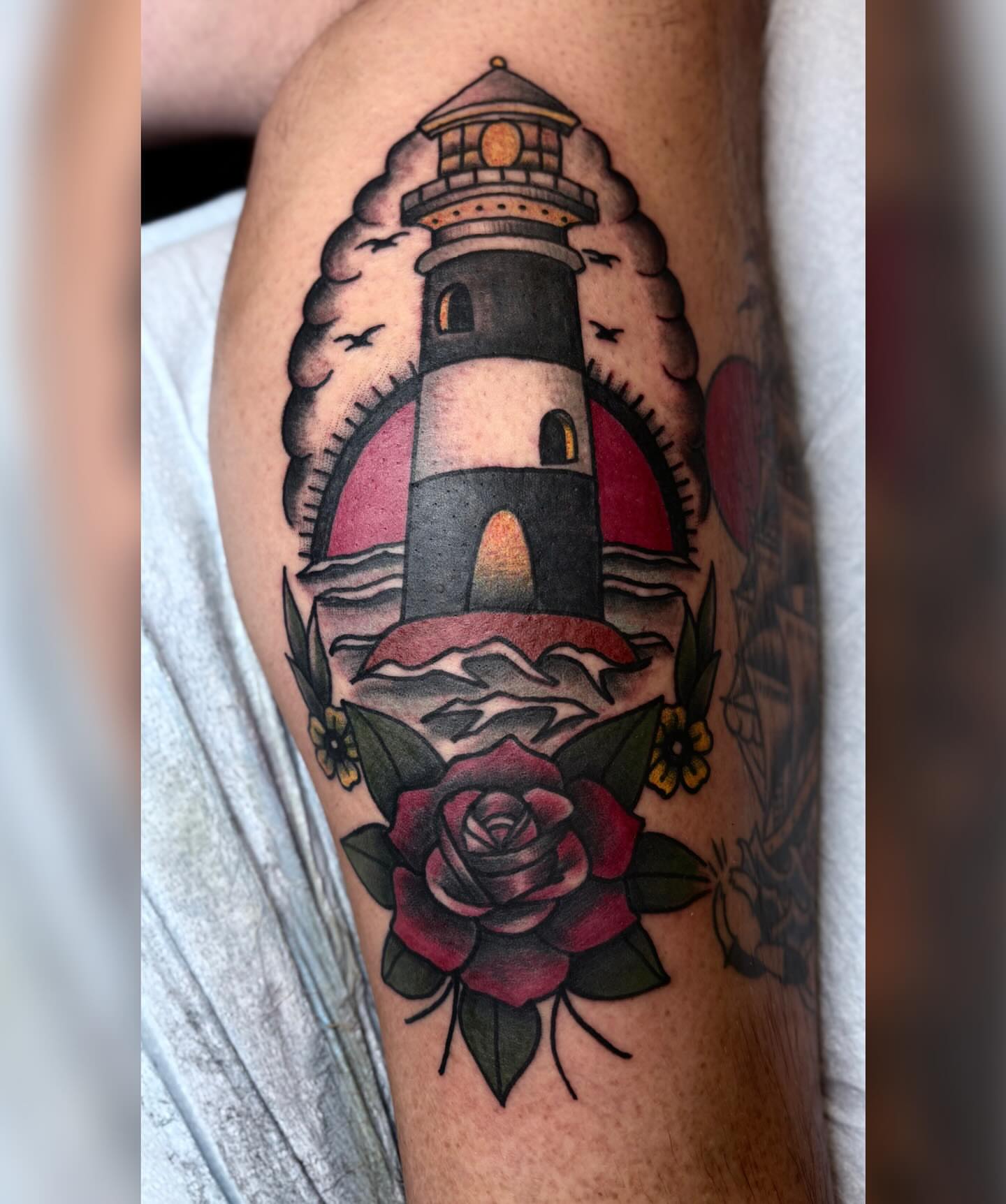 Lighthouse and rose American traditional tattoo on the forearm by ππ©π’π΅ππ«π‘π―π ππ¬π«π’π°