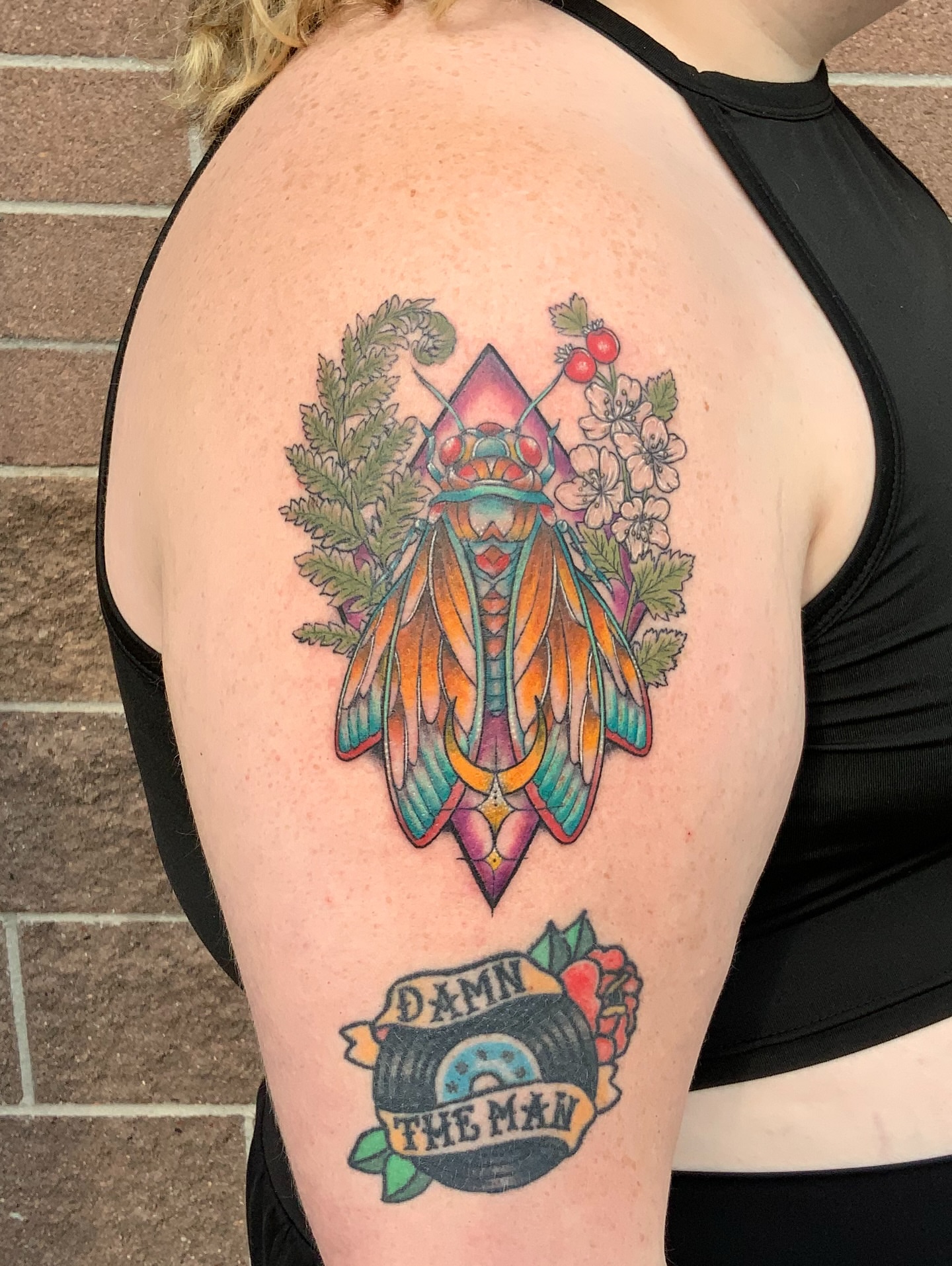 Insect and floral new school tattoo on the shoulder by QUEEN TATTOO Stephanie Larson
