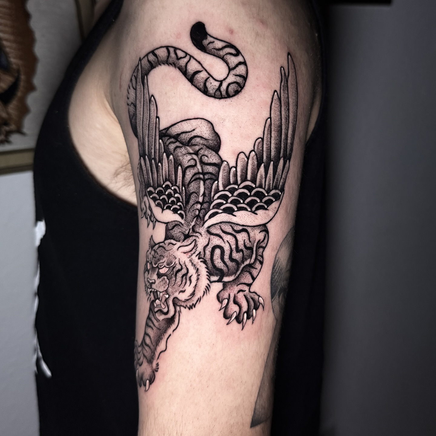 Tiger and snake black and grey tattoo on the forearm by @sadfoo_tattoo, Austin, Texas