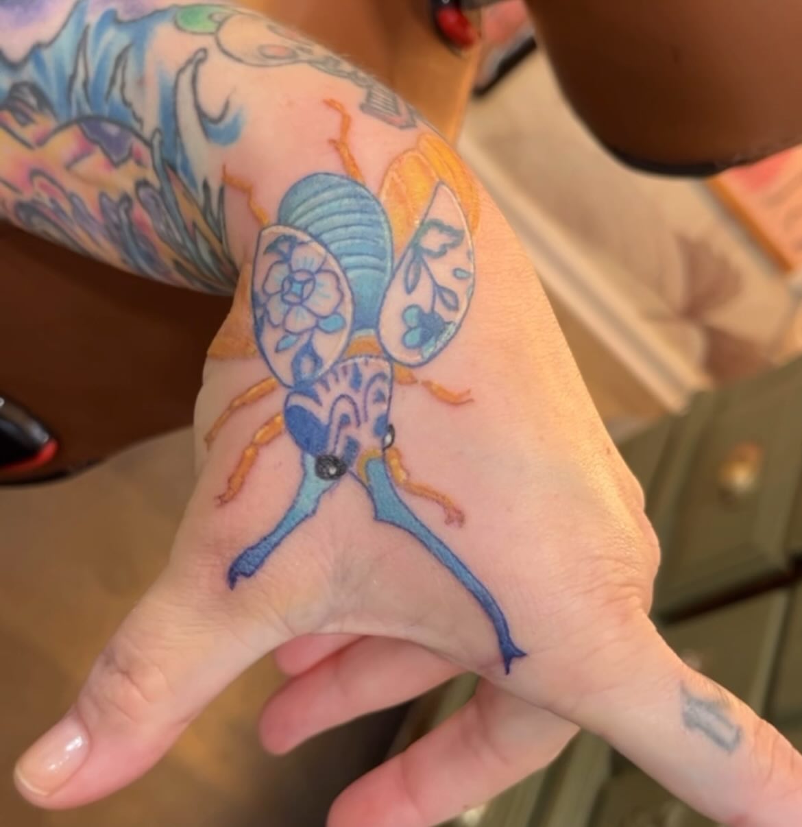 Insect new school tattoo on the hand by Brandie Caroline, Somers Point, New Jersey