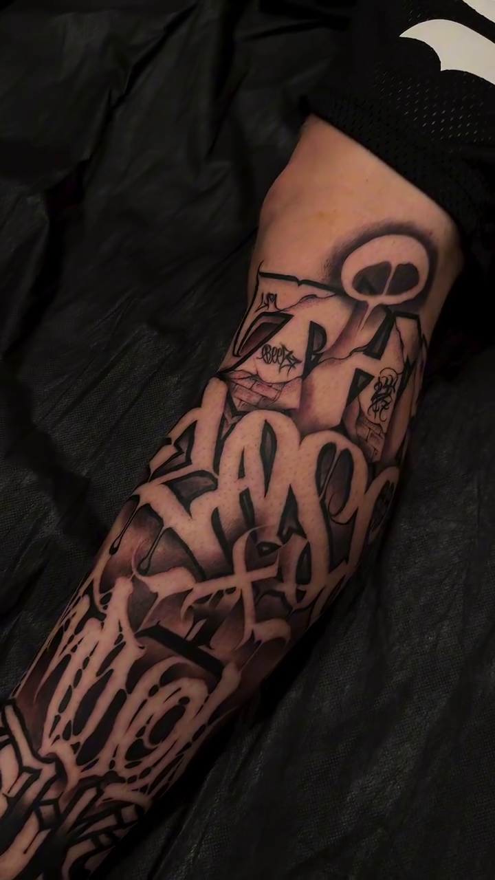Graffiti lettering blackwork tattoo by Letterrealmstudio