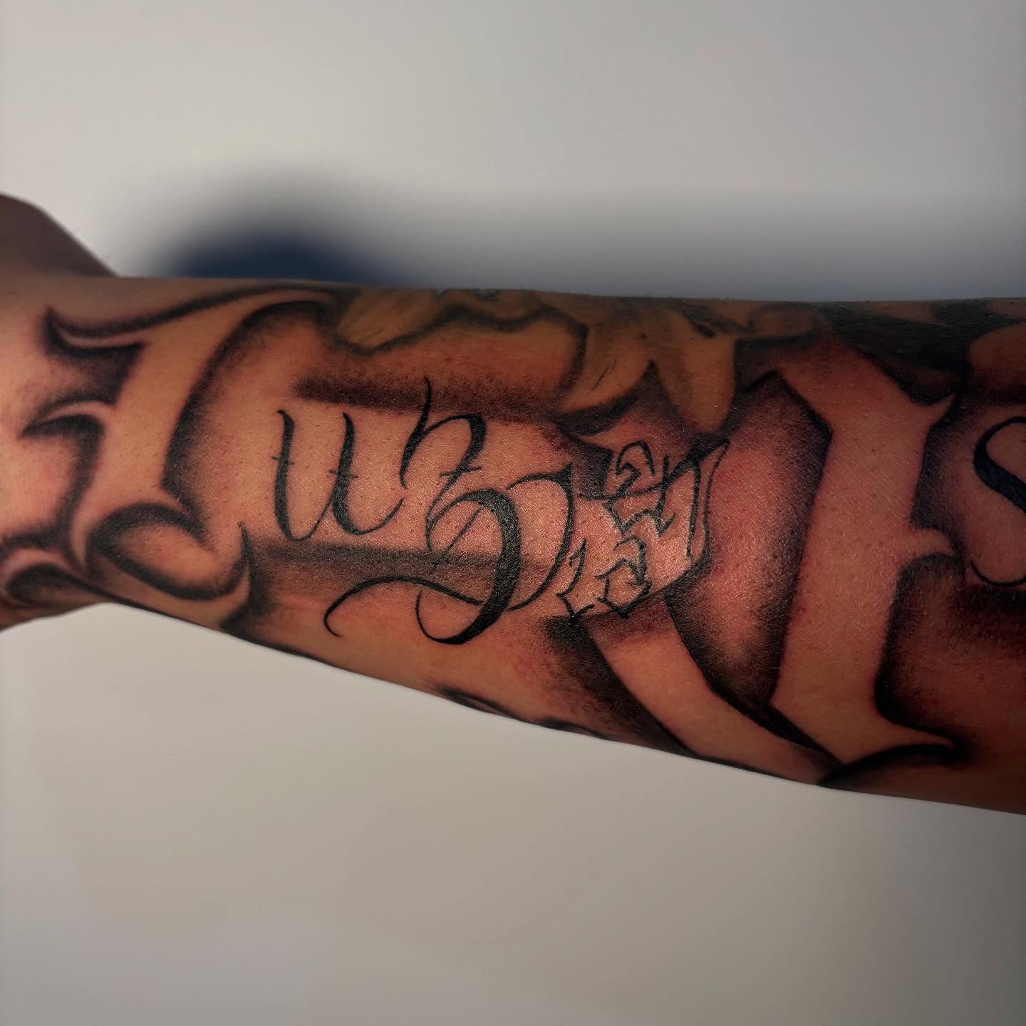 Script lettering lettering script tattoo on the forearm by Lee