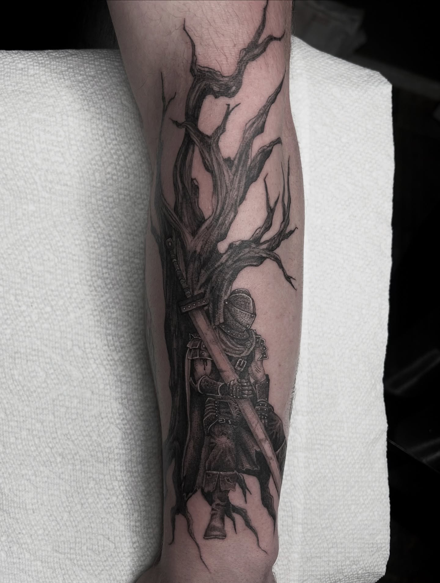 Tree and knight realism tattoo on the forearm by 𝕤𝕒𝕧𝕒𝕟𝕟𝕒