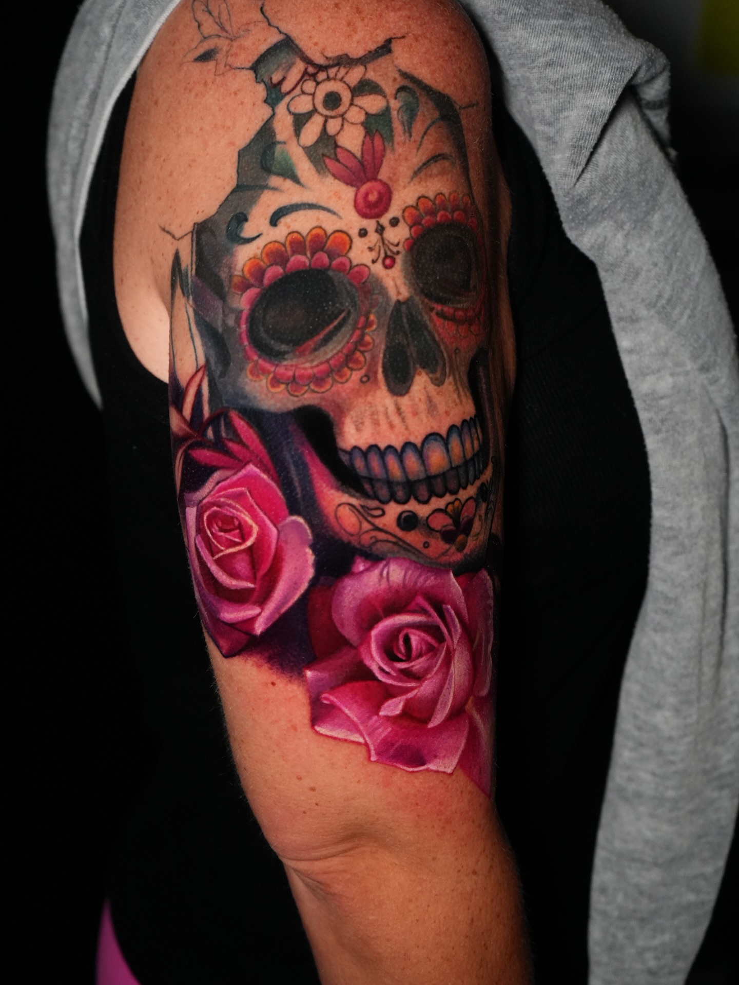 Sugar skull with roses realism tattoo on the forearm by Robert Morton, Cleveland, Ohio