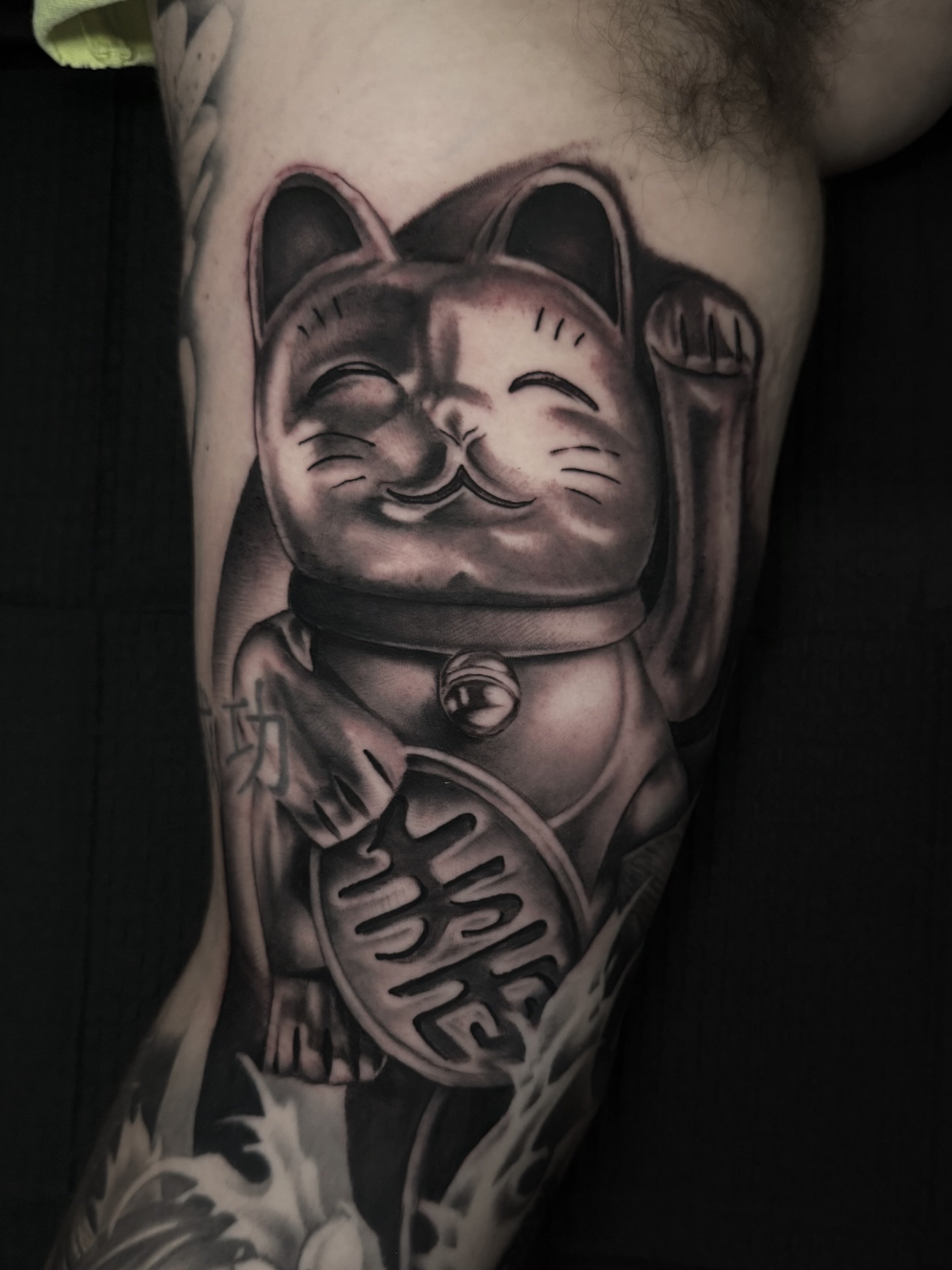 Maneki-neko black and grey tattoo on the forearm by Matt Misiak