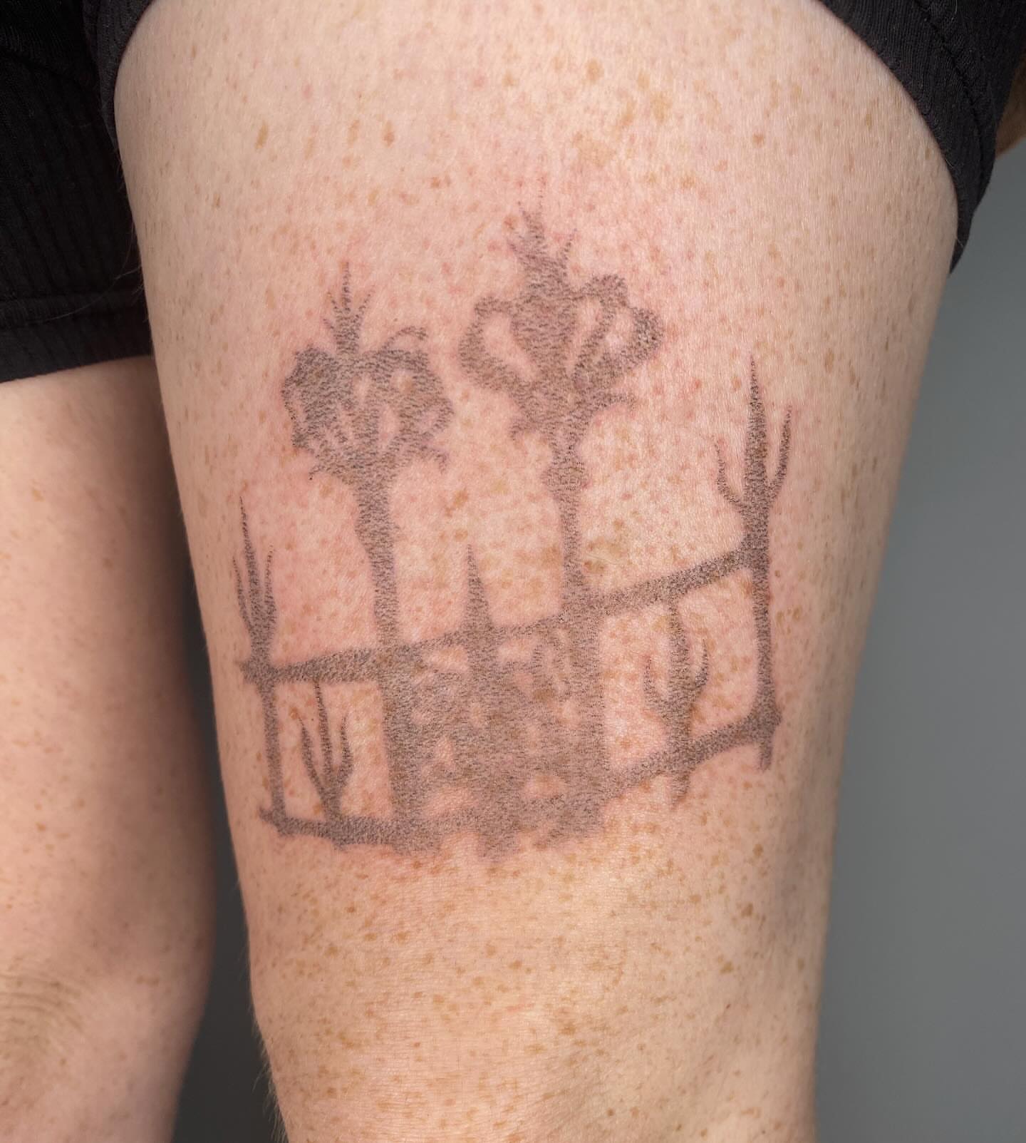 Trees and fence black and grey tattoo on the thigh by 🌀☁️kath☁️🥀