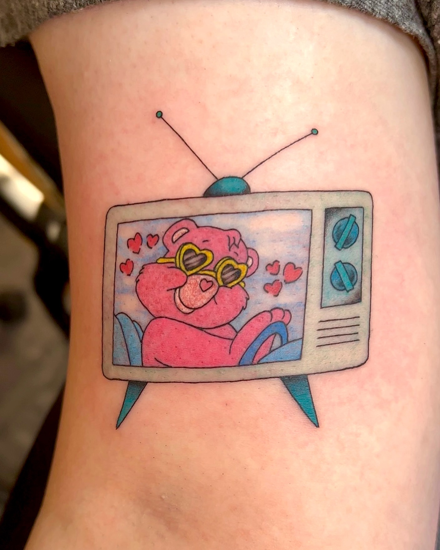Care bear on TV new school tattoo on the forearm by Cortnie, Nashville, Tennessee