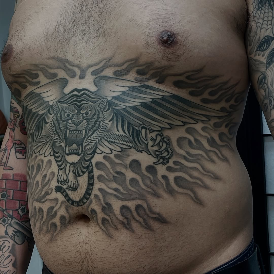 Tiger with wings and flames realism tattoo on the chest by Mister Joe Joe Frisco Tattoo, San Francisco, California