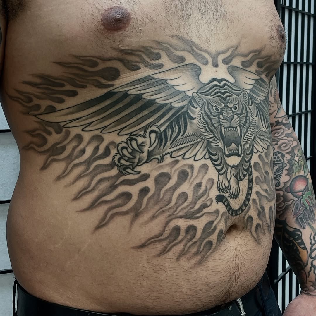 Tiger with wings and flames Japanese tattoo on the chest by Mister Joe Joe Frisco Tattoo, San Francisco, California