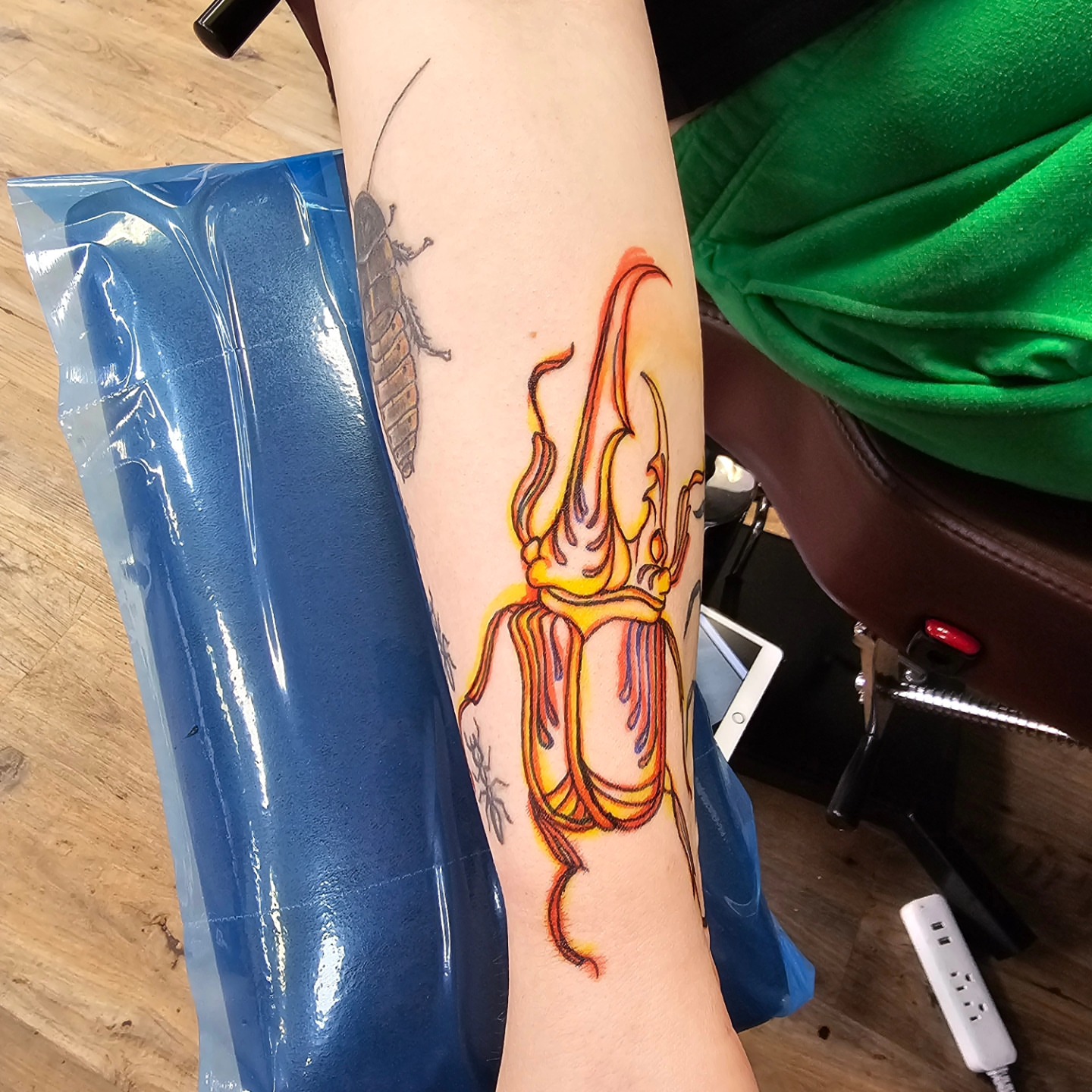 Squid new school tattoo on the forearm by Derek Davis
