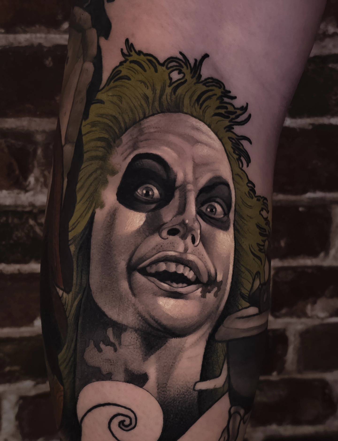 Beetlejuice character realism tattoo on the forearm by Nathan Thomas
