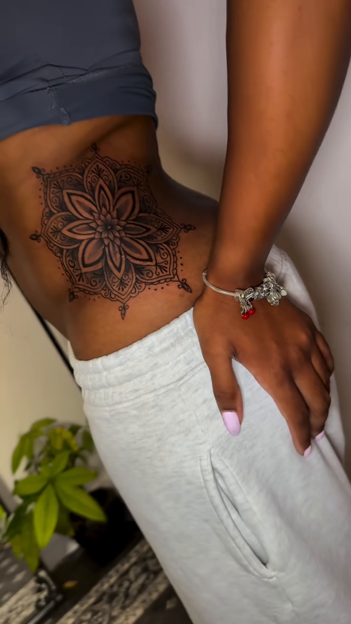 Mandala ornamental tattoo on the torso by Ivy lee