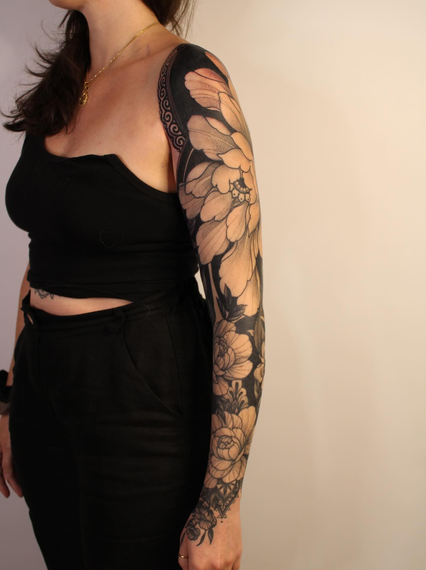 Floral bouquet black and grey tattoo on the upper arm by Samantha Compasso Ford