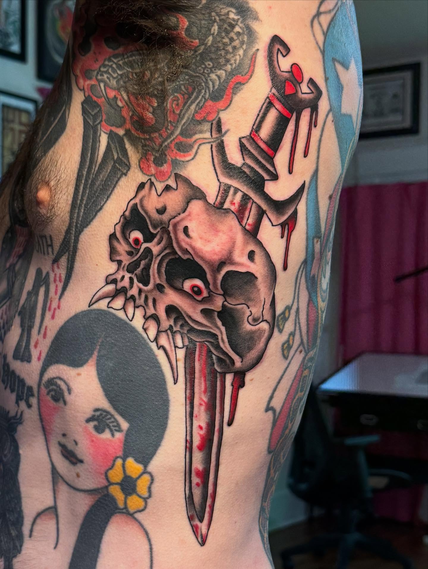 Skull and dagger American traditional tattoo on the torso by Hannah Edwards, Austin, Texas