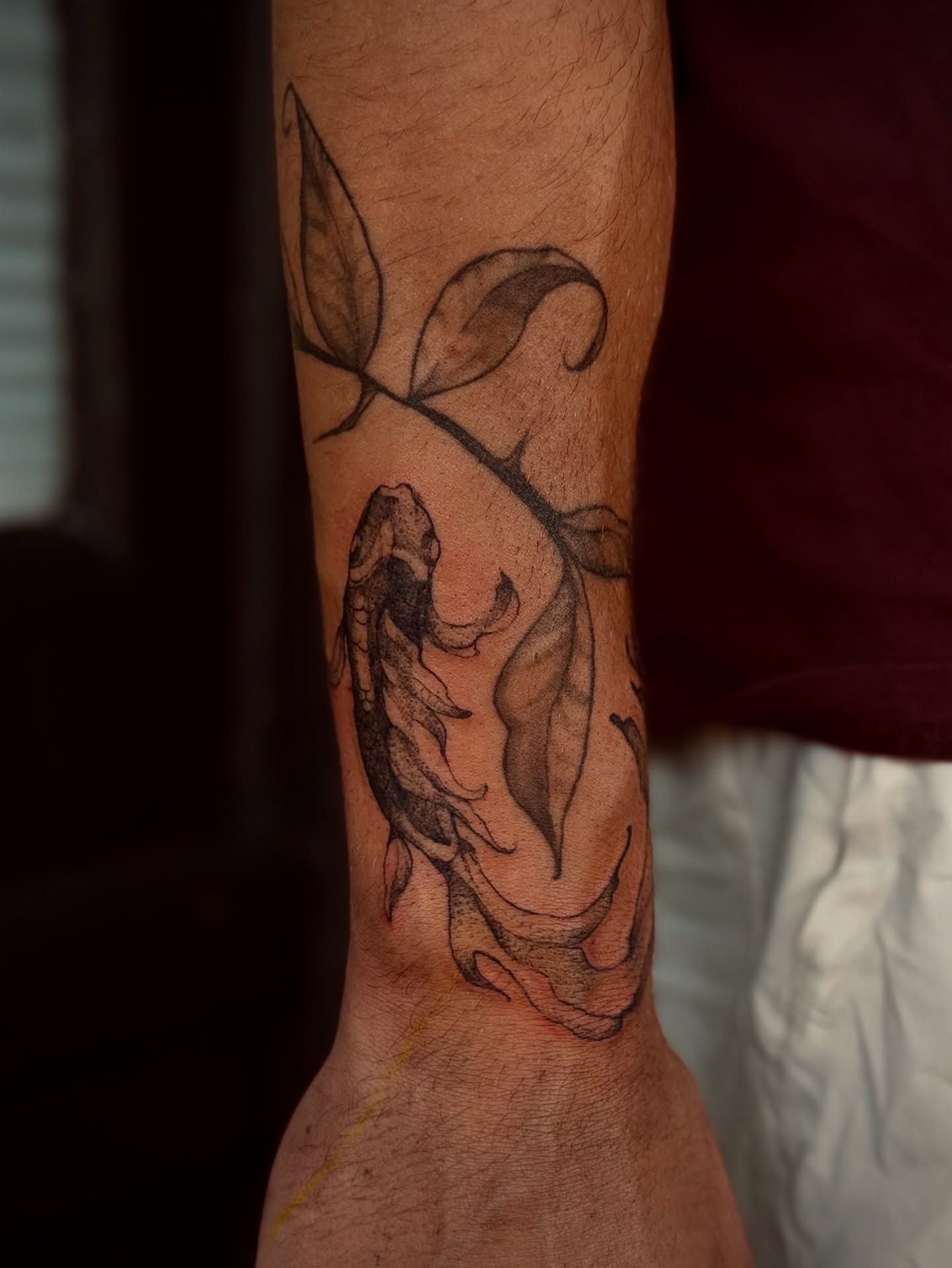 Koi fish black and grey tattoo on the forearm by 𝙹𝙰𝚉𝚉 𝙲𝙷𝙰𝙾