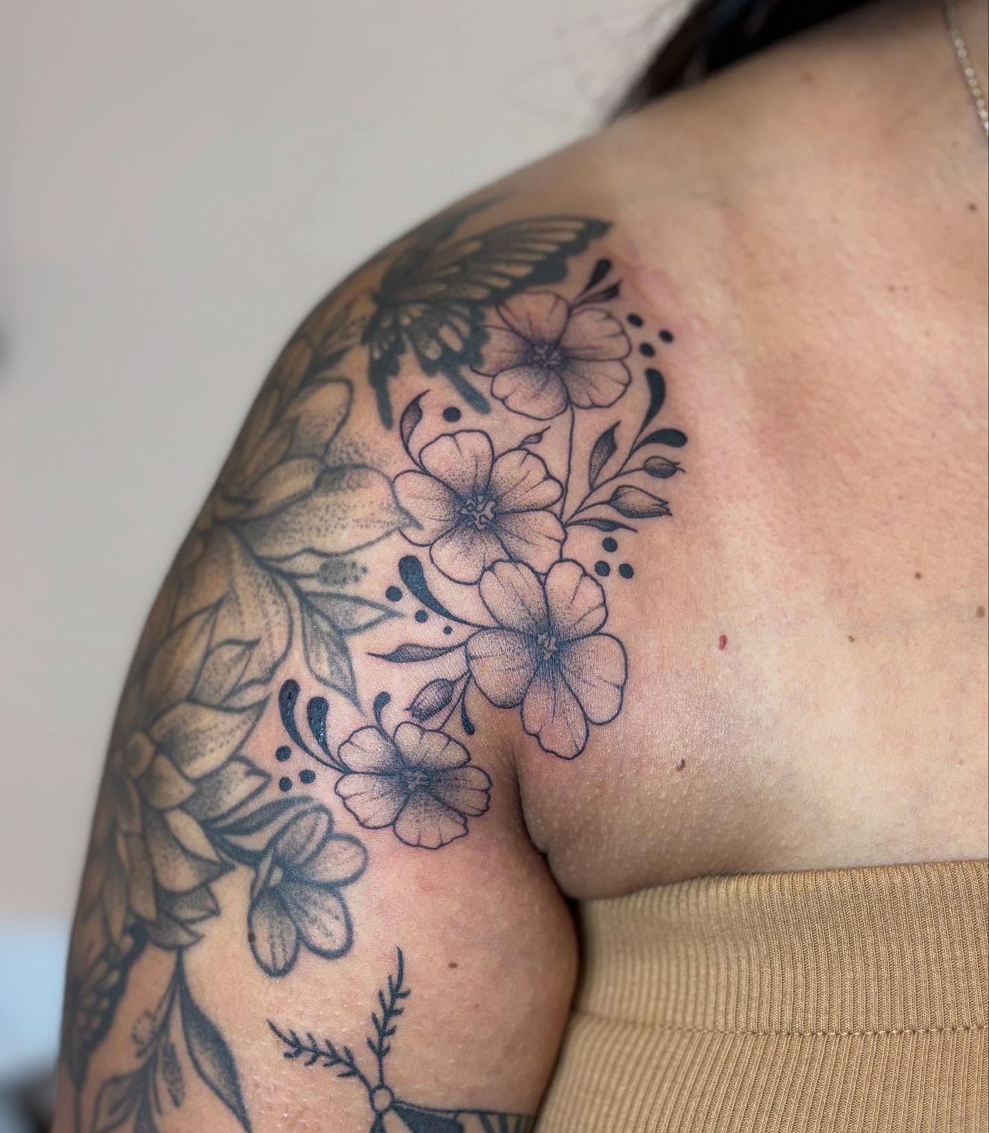 Flowers and butterfly dotwork tattoo on the shoulder by Rye⚡️🎱🍒🐆🖤
